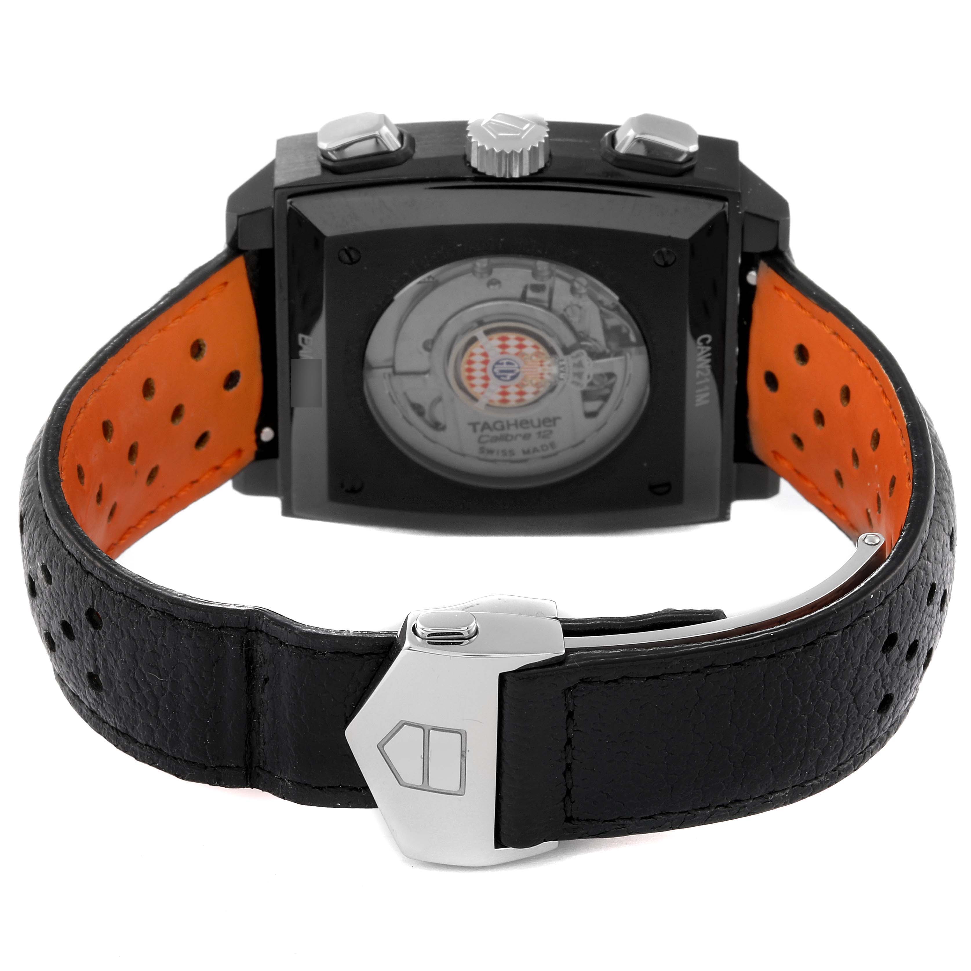 The image shows the back view of the Tag Heuer Limited Edition CAW211M.FC6324 Men's Titanium Black Dial CAW211M.FC6324 Men's Titanium Black Dial model, highlighting the black leather strap, buckle, and transparent case back.