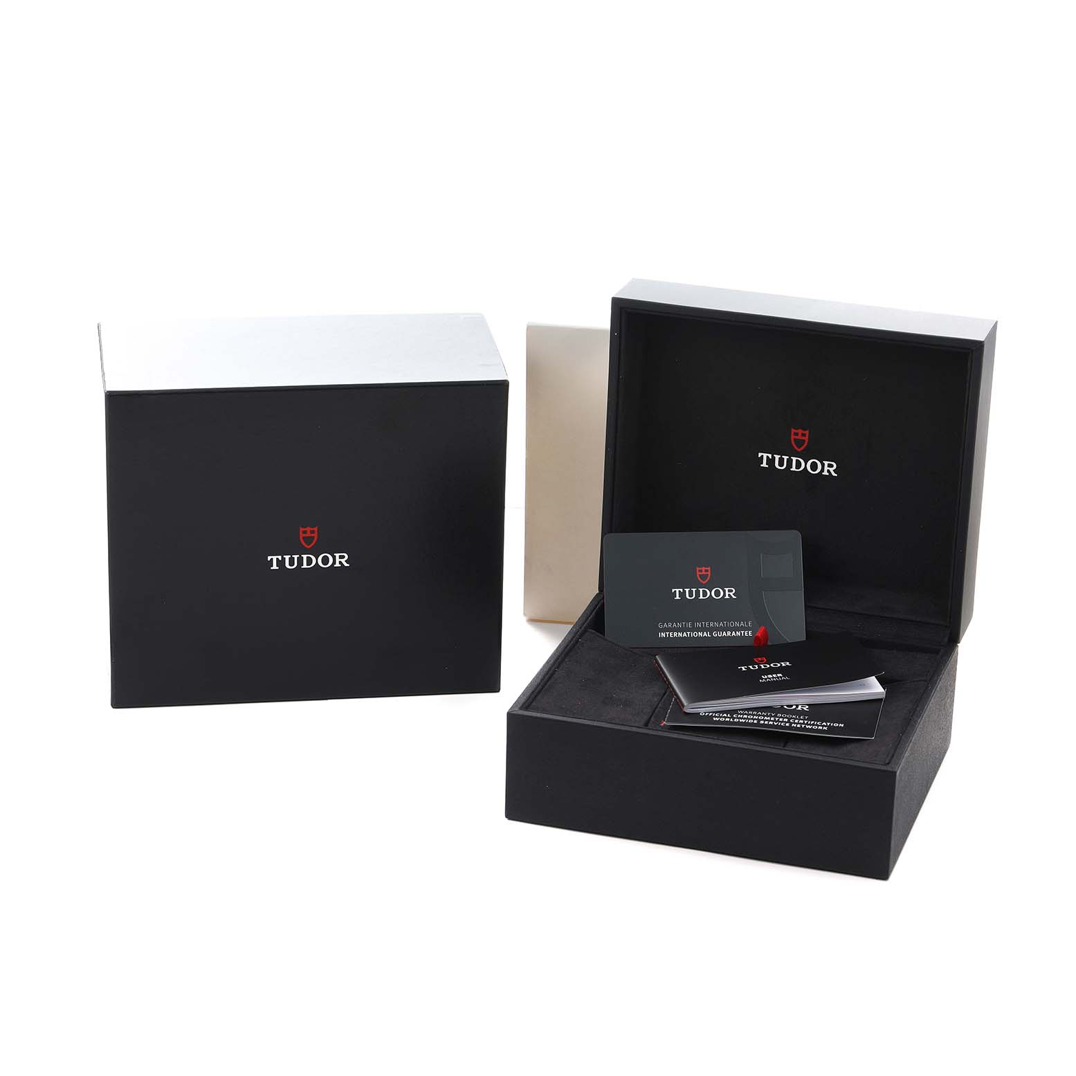 The Tudor Heritage Black Bay 79830RB Men
s Stainless Steel Black Dial packaging is shown with an open box, warranty card, and booklet visible.
