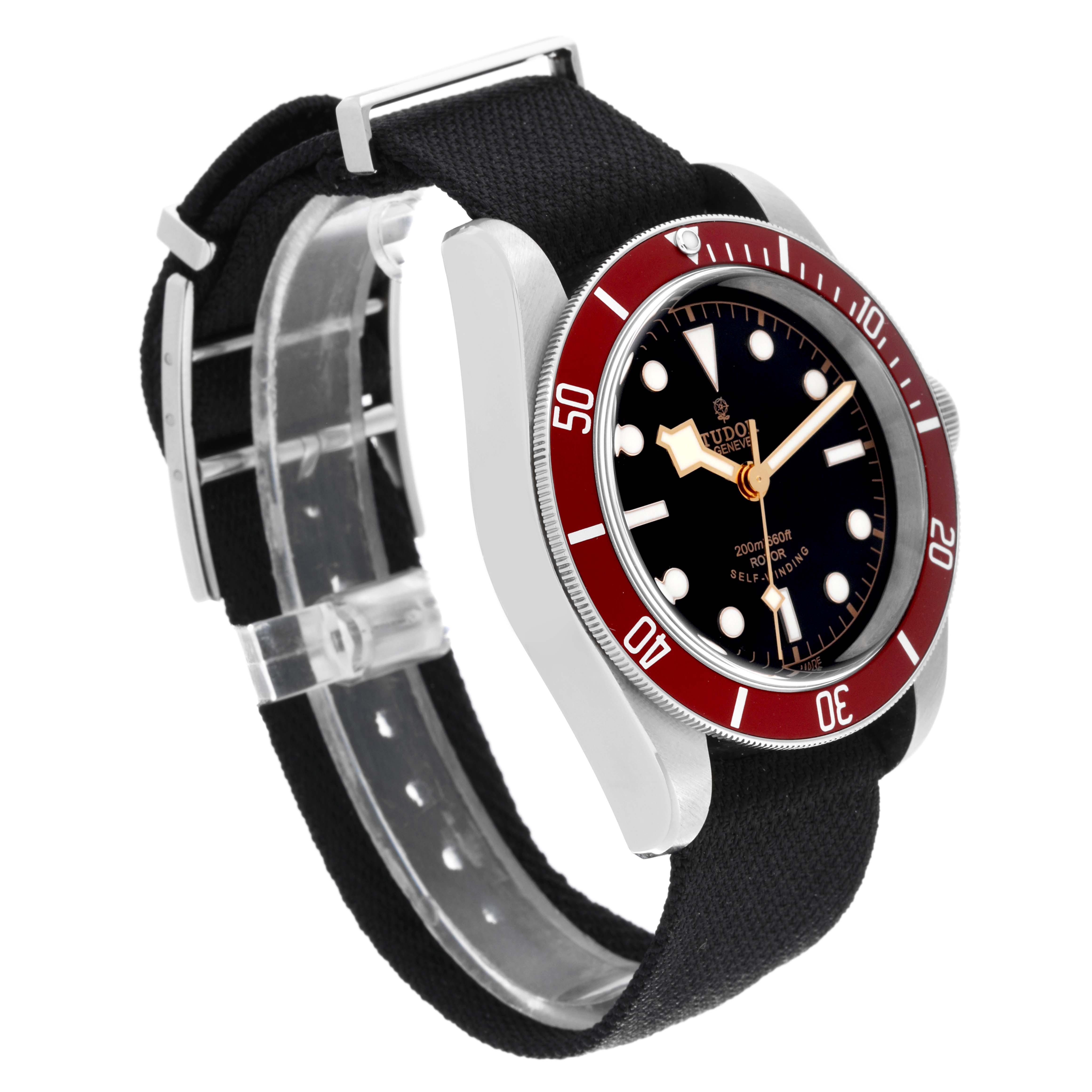 The image shows a Tudor Heritage Black Bay 79220R Men's Stainless Steel Black Dial 79220R Men's Stainless Steel Black Dial watch at a three-quarter angle, highlighting its black dial, red bezel, and strap.