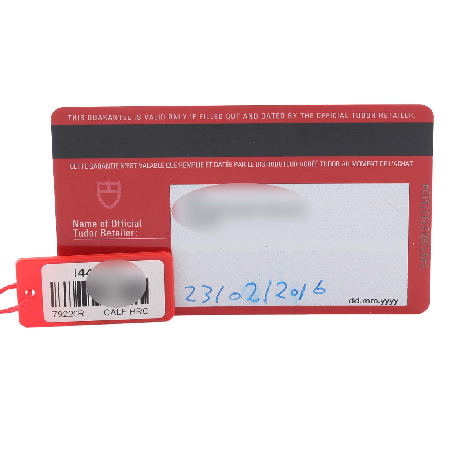 The image shows the warranty card and tag for the Tudor Heritage Black Bay 79220R Men's Stainless Steel Black Dial 79220R Men's Stainless Steel Black Dial watch, displaying the retailer's name and purchase date.