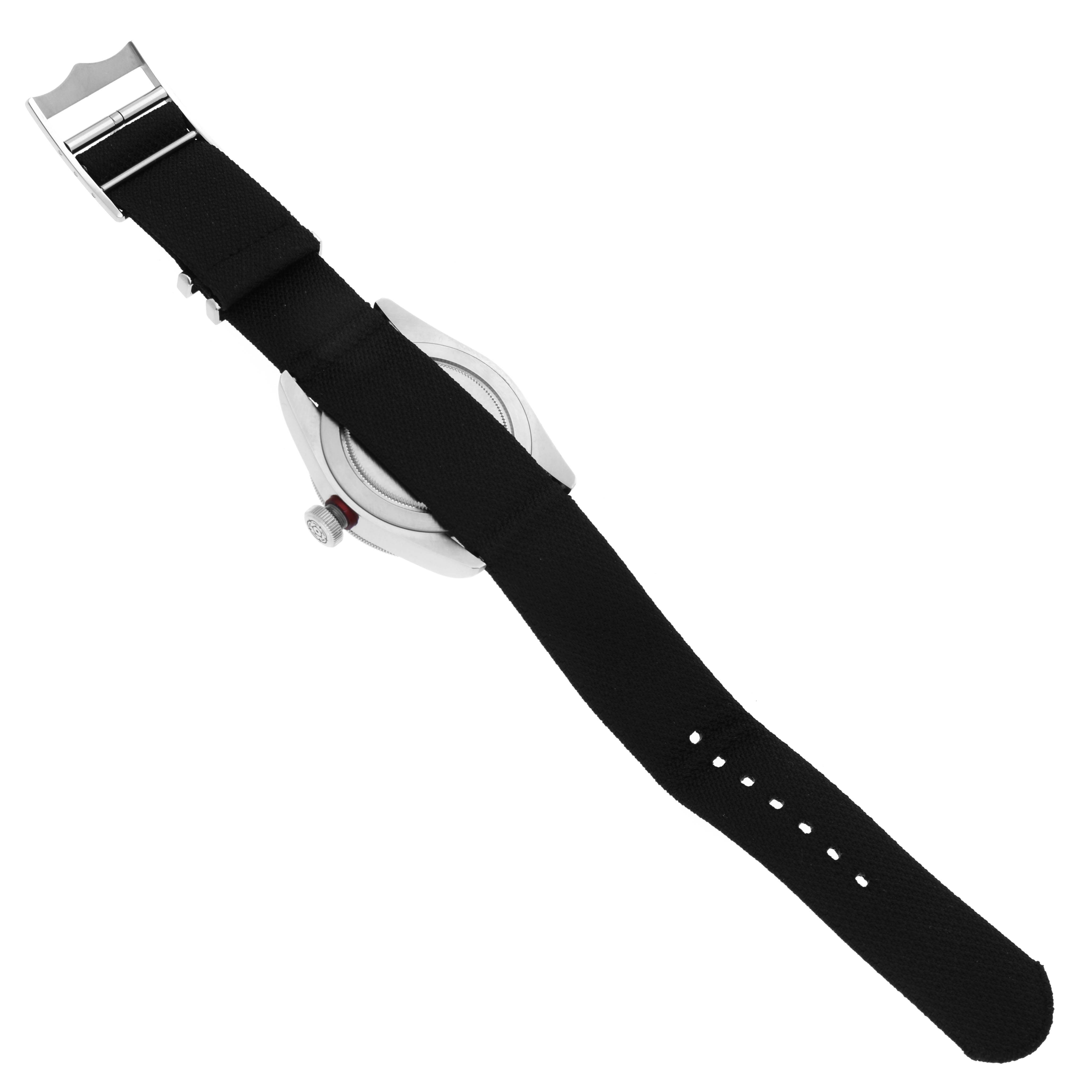 The image shows the reverse side of a Tudor Heritage Black Bay 79220R Men's Stainless Steel Black Dial 79220R Men's Stainless Steel Black Dial watch focusing on the strap and the side of the case.