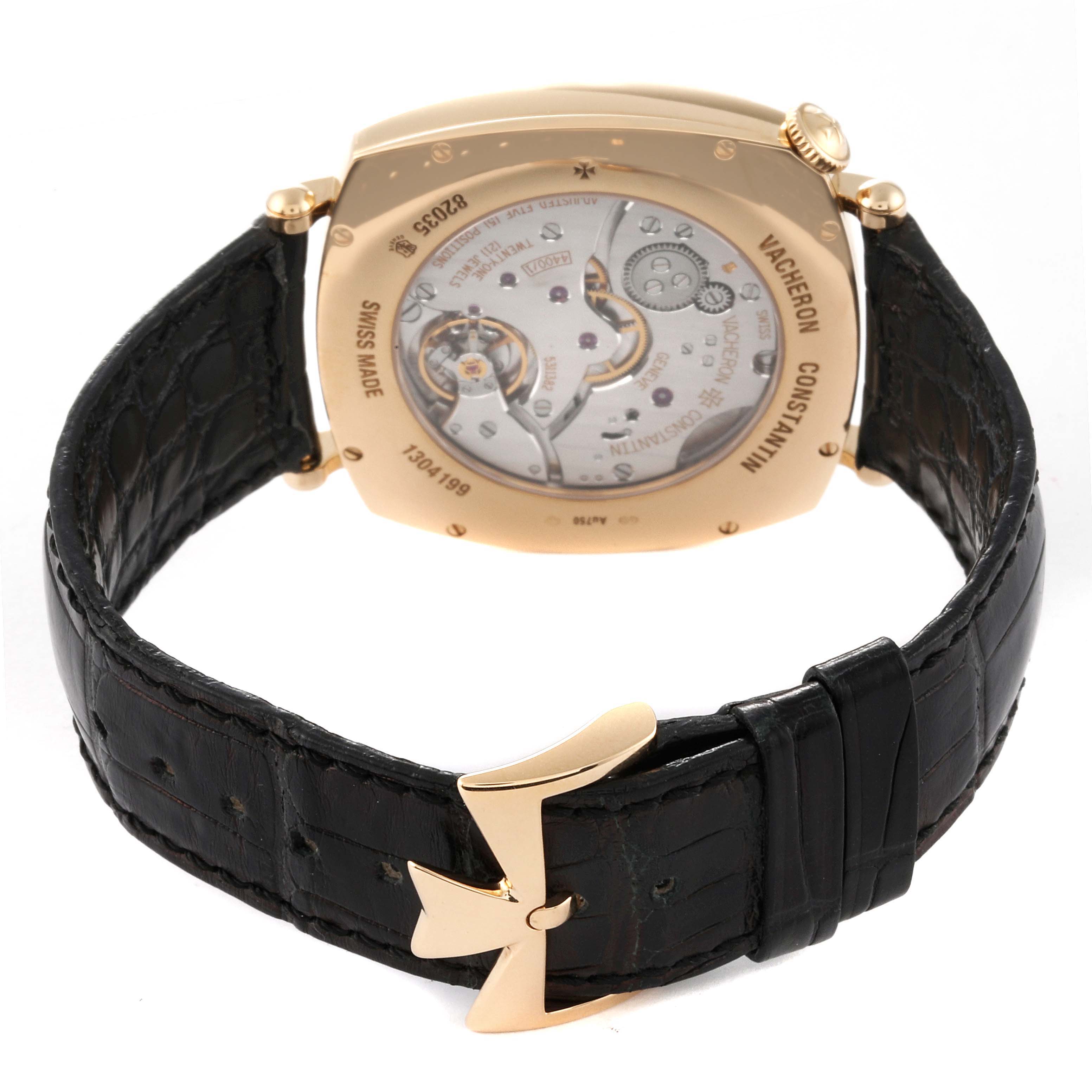 The image shows the back view of the Vacheron Constantin Historiques 82035/000J-9964 Men
s Yellow Gold Silver Dial 82035/000J-9964 Men
s Yellow Gold Silver Dial watch, highlighting the movement mechanism and black leather strap.