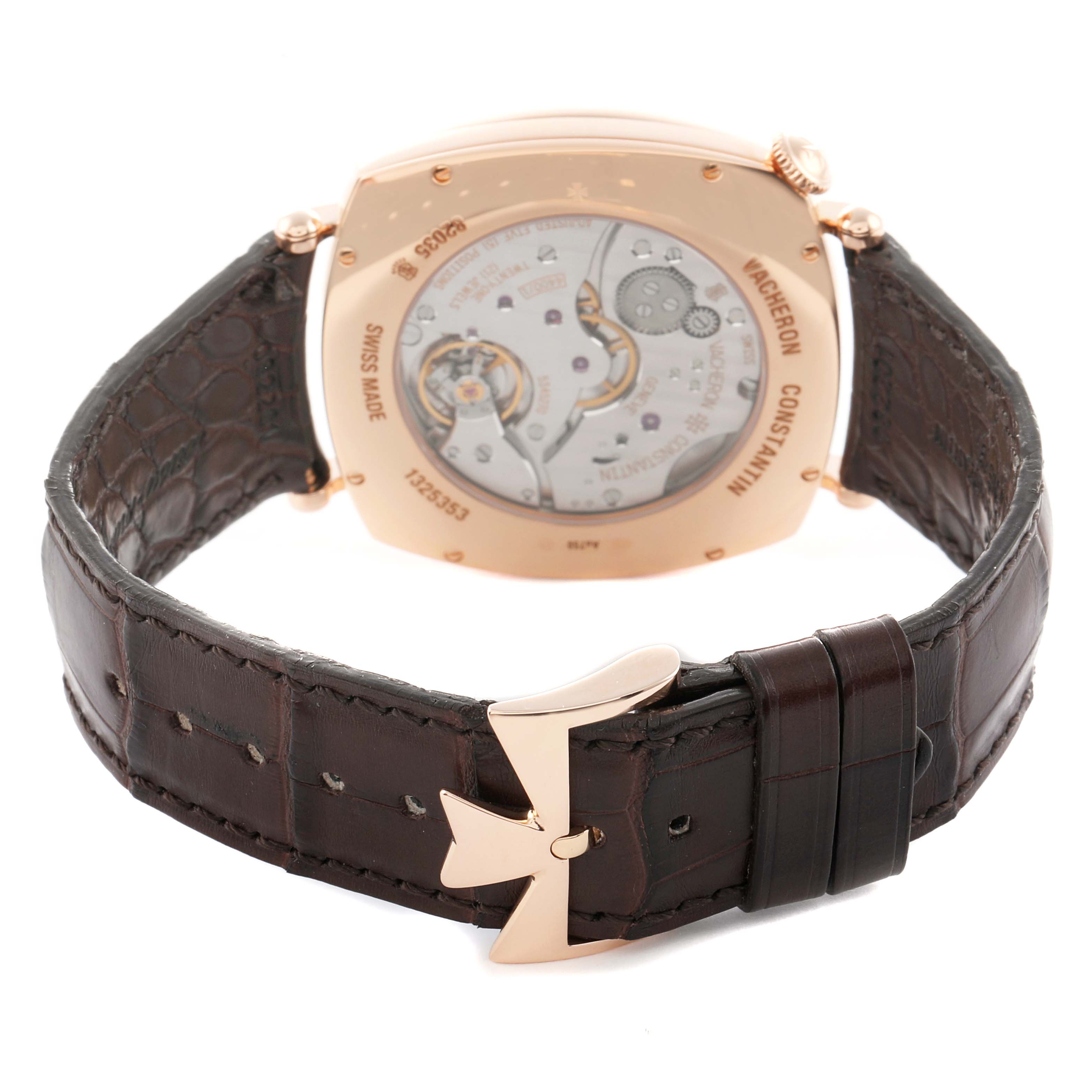 The image shows the back of a Vacheron Constantin Historiques 82035/000R-9359 Men
s Rose Gold Silver Dial watch, highlighting the case back and leather strap with a distinctive clasp.
