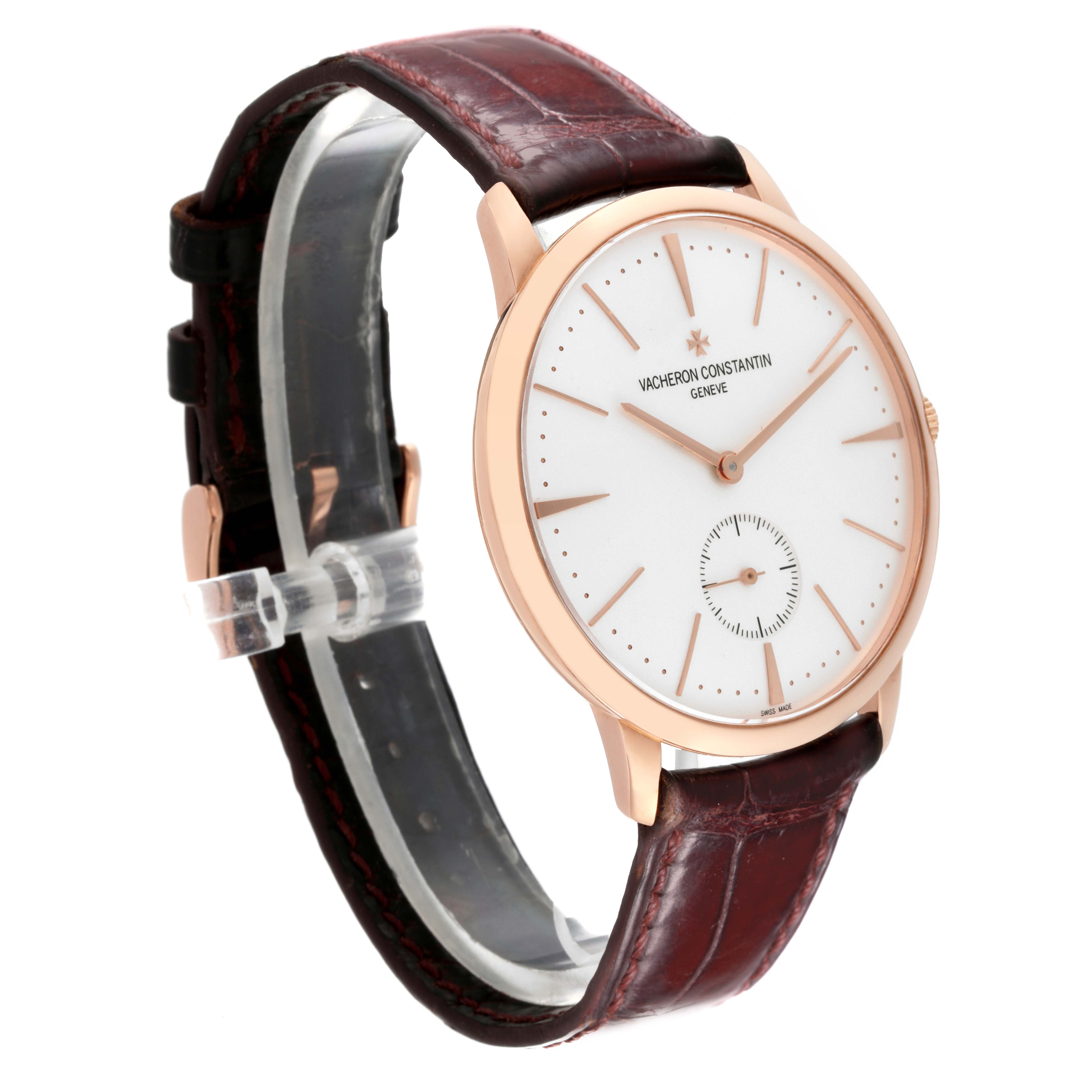 The image shows a Vacheron Constantin Patrimony 1110U/000R Men's Rose Gold Silver Dial 1110U/000R Men's Rose Gold Silver Dial watch at an angle, highlighting its face, case, hands, and leather strap.