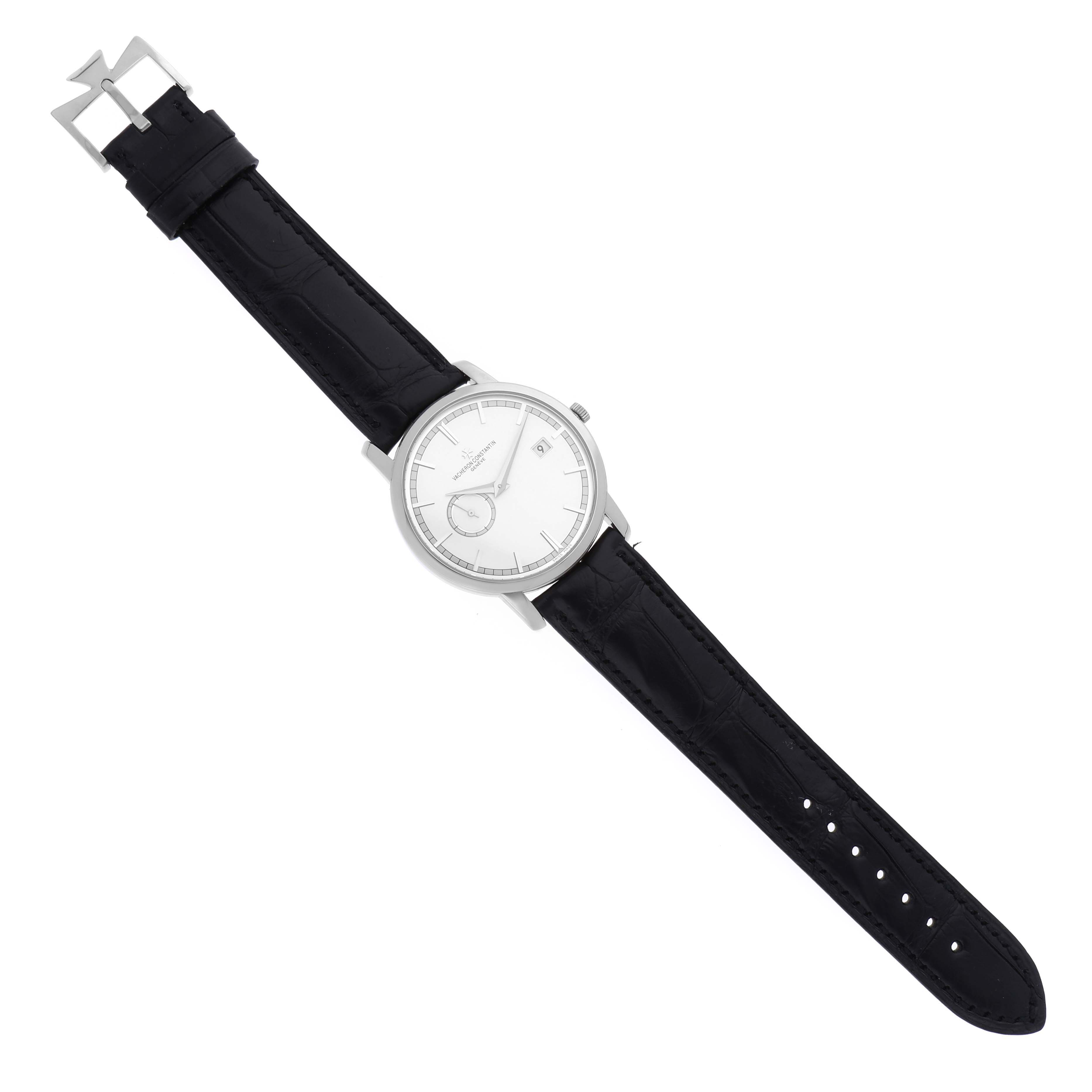 The Traditionnelle model watch by Vacheron Constantin is shown from a top-down angle, displaying the face, case, and black leather strap.