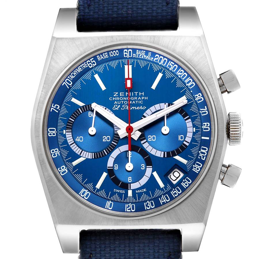 The Zenith Chronomaster watch is shown from a frontal angle, highlighting the blue dial, subdials, tachymeter scale, and side pushers.