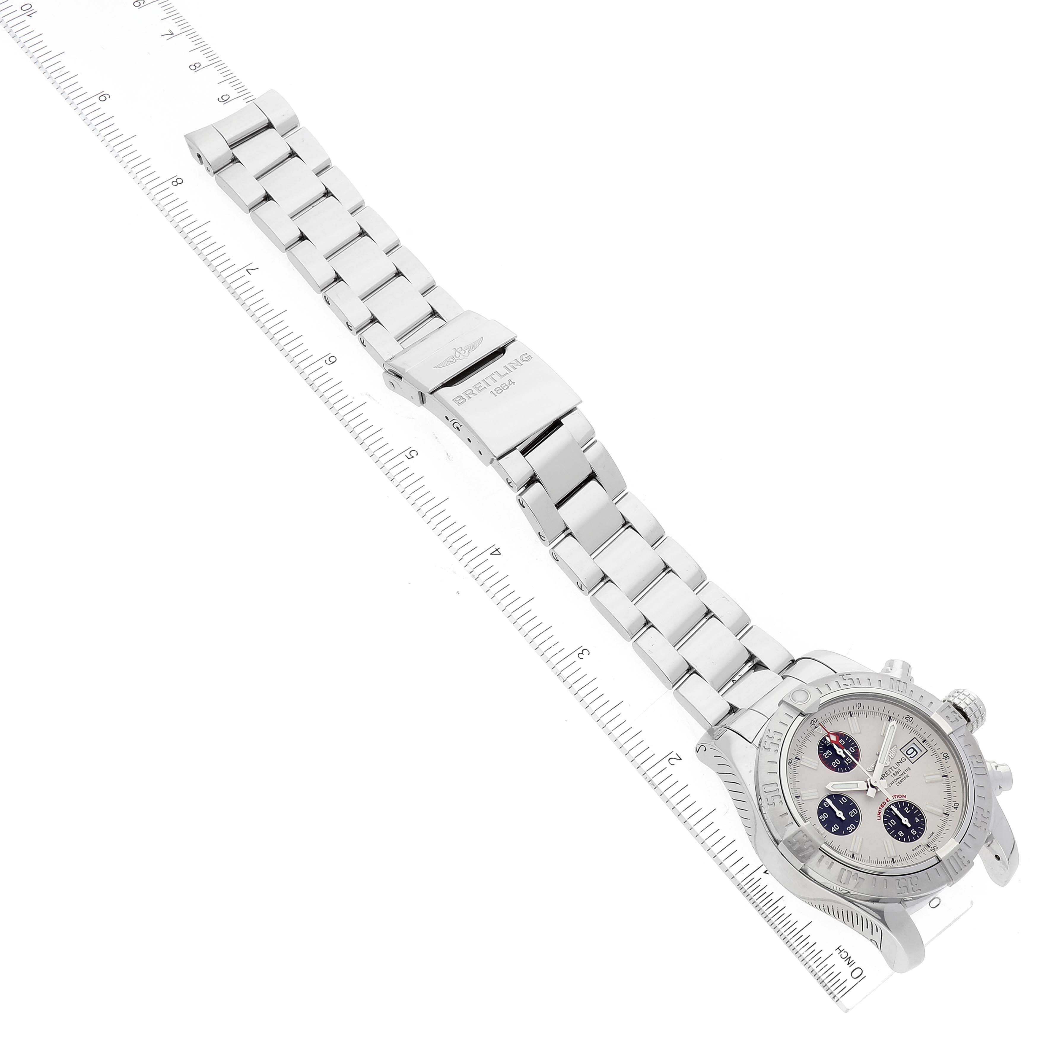 The image shows the Breitling Avenger A13381 Men's Stainless Steel White Dial A13381 Men's Stainless Steel White Dial watch from a top-down angle, displaying both the face and metal strap.