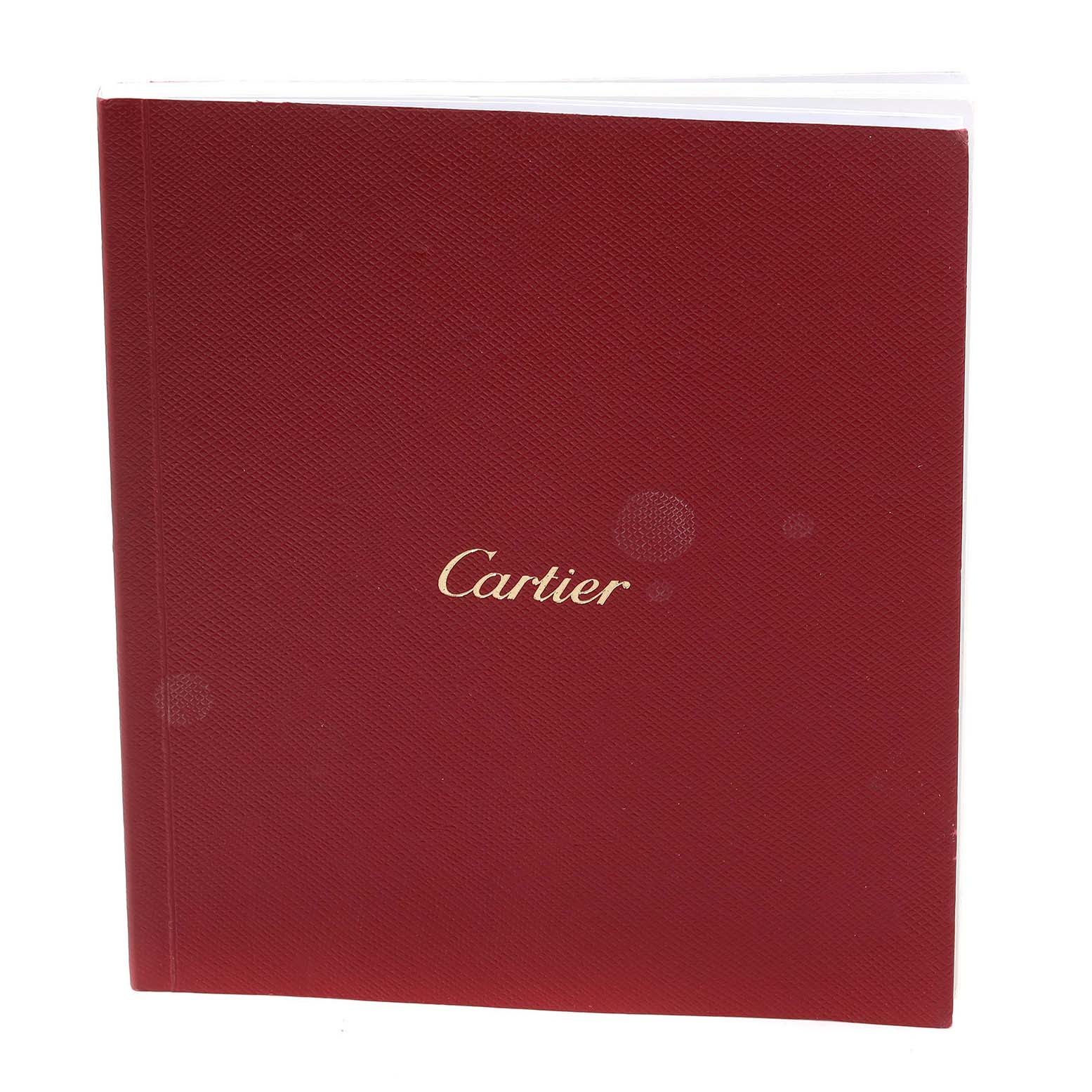 This image shows a red booklet with the Cartier logo for the Ballon Bleu model by Cartier.