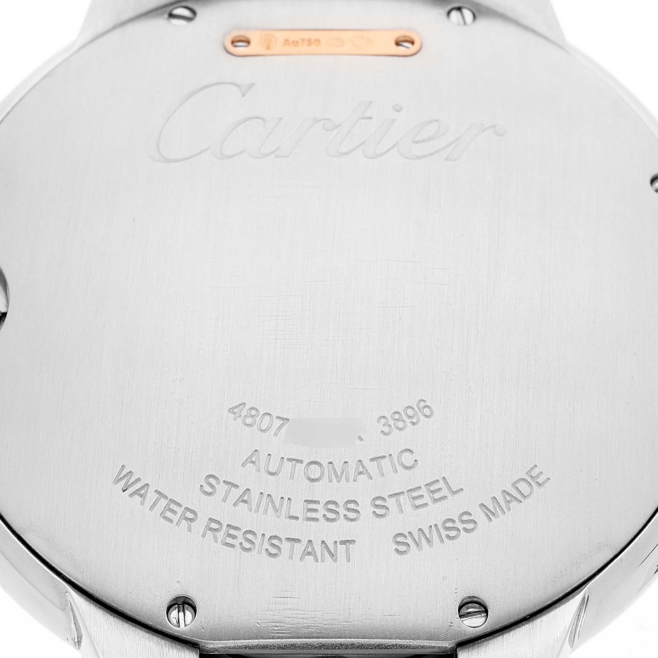 The image shows the back case of a Ballon Bleu watch by Cartier, highlighting engravings and material details.