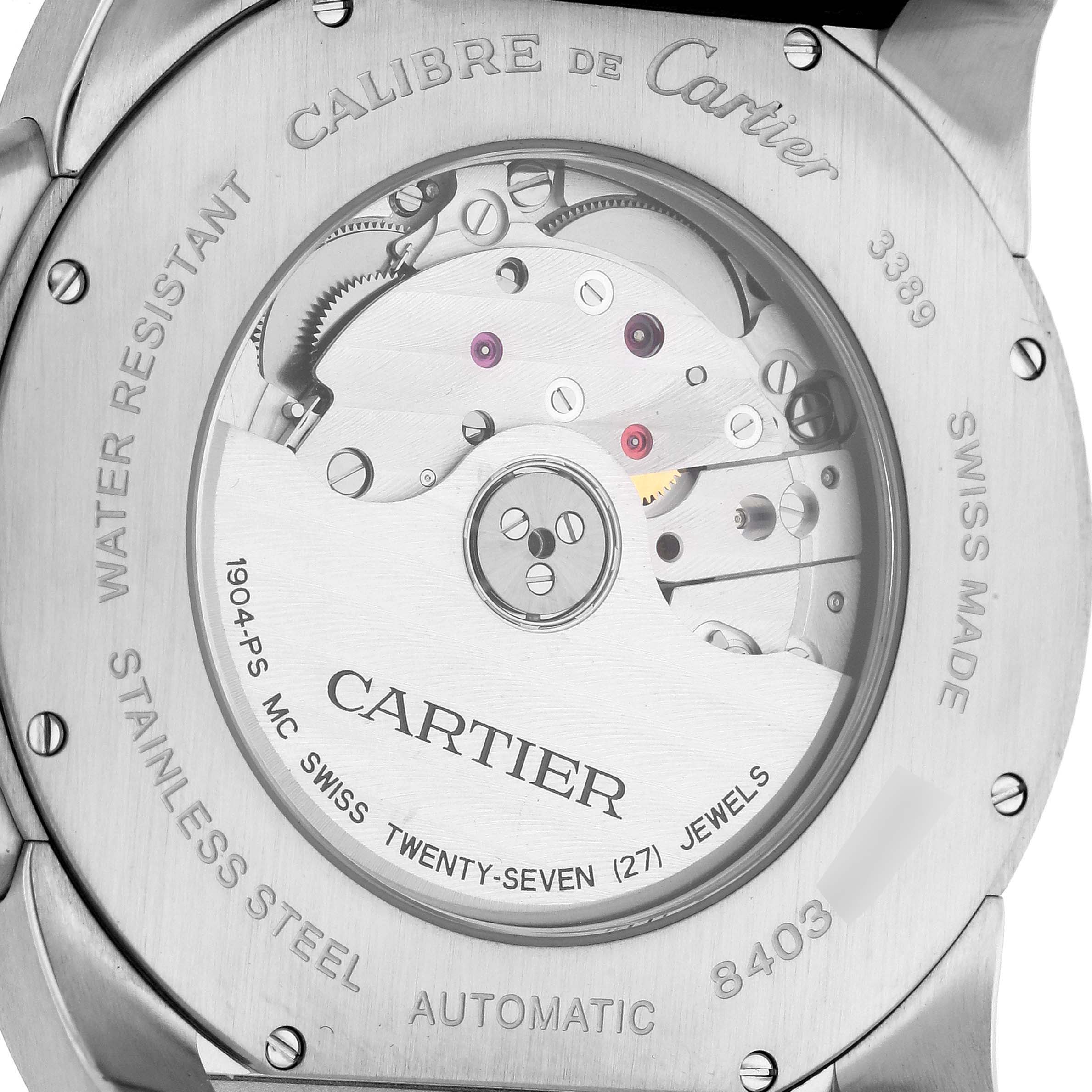 This image shows the back of the Calibre de Cartier watch by Cartier, revealing its automatic movement and details.