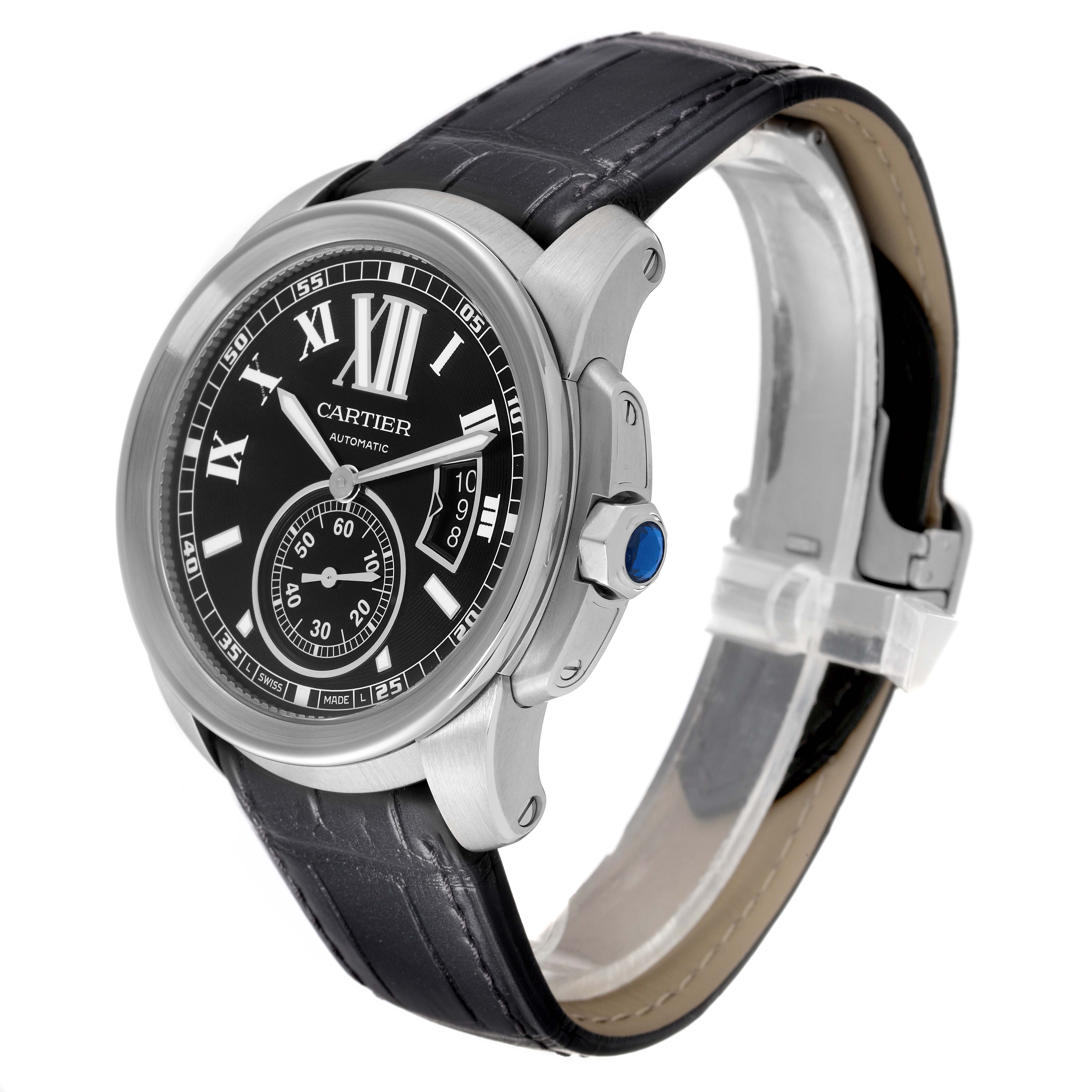 The Calibre de Cartier watch by Cartier is shown at a slight angle, highlighting its black dial, case, and leather strap.