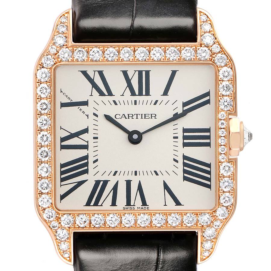 The image shows a Cartier Santos Dumont WH100351 Men's Rose Gold Silver Dial watch from a front angle, highlighting its square face, diamond-studded bezel, and leather strap.