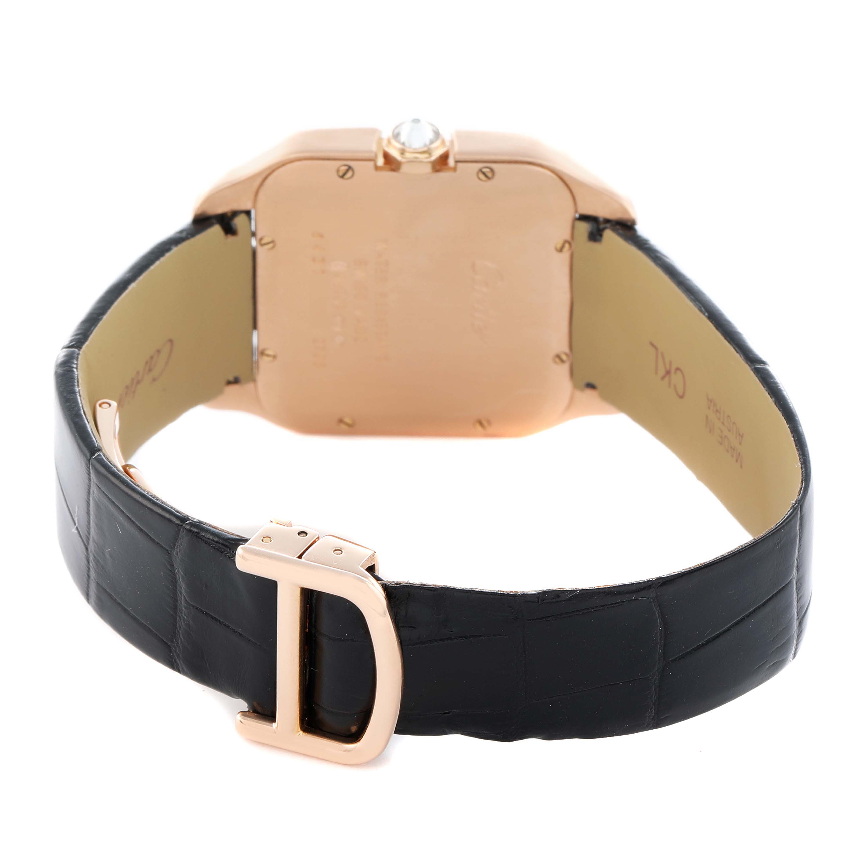 The image shows the back of a Cartier Santos Dumont WH100351 Men
s Rose Gold Silver Dial watch, highlighting the case back and black leather strap with a clasp.
