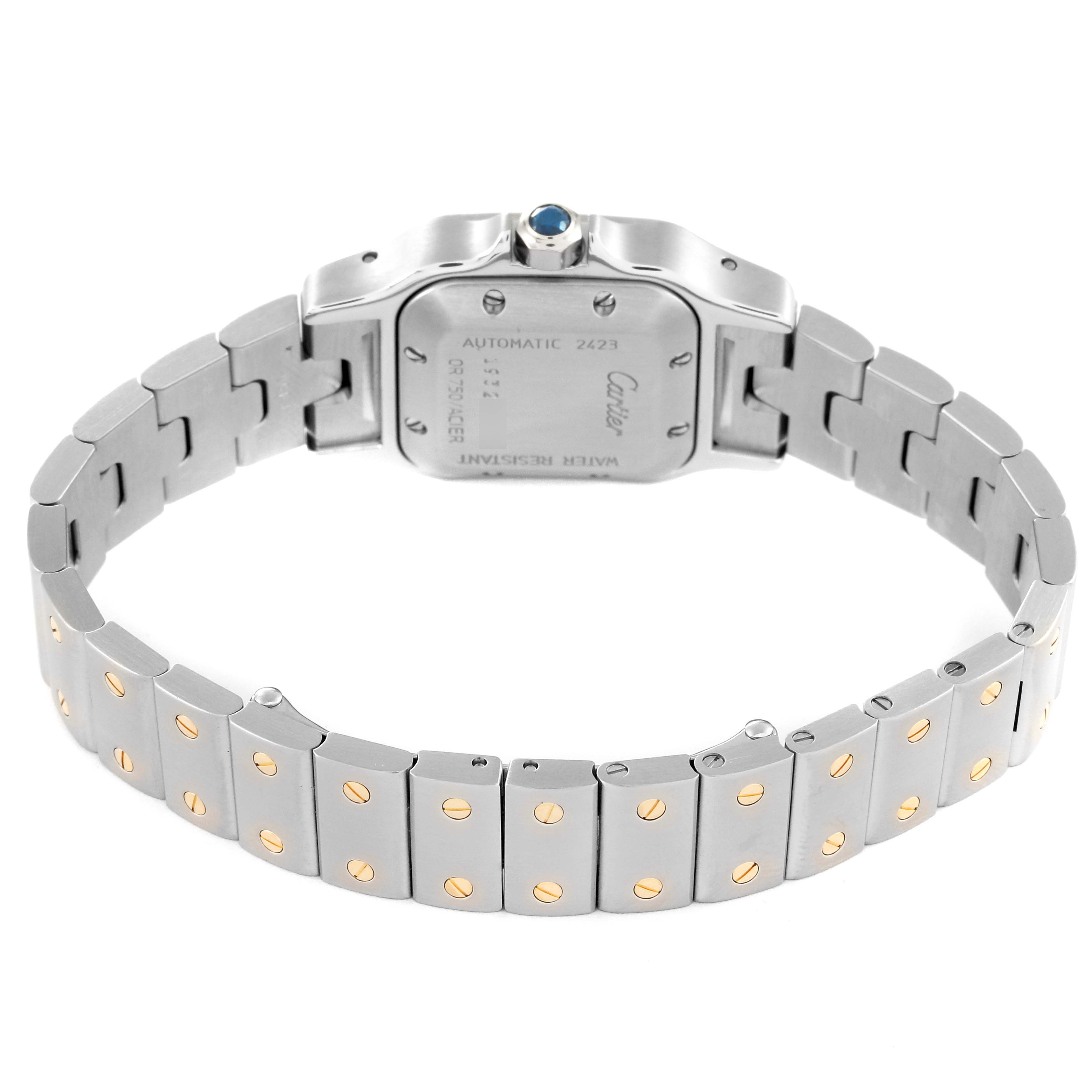 This image shows the backside of the Cartier Santos W20057C4 Women's Stainless Steel Silver Dial W20057C4 Women's Stainless Steel Silver Dial watch, focusing on the case back and the bracelet with gold screw accents.