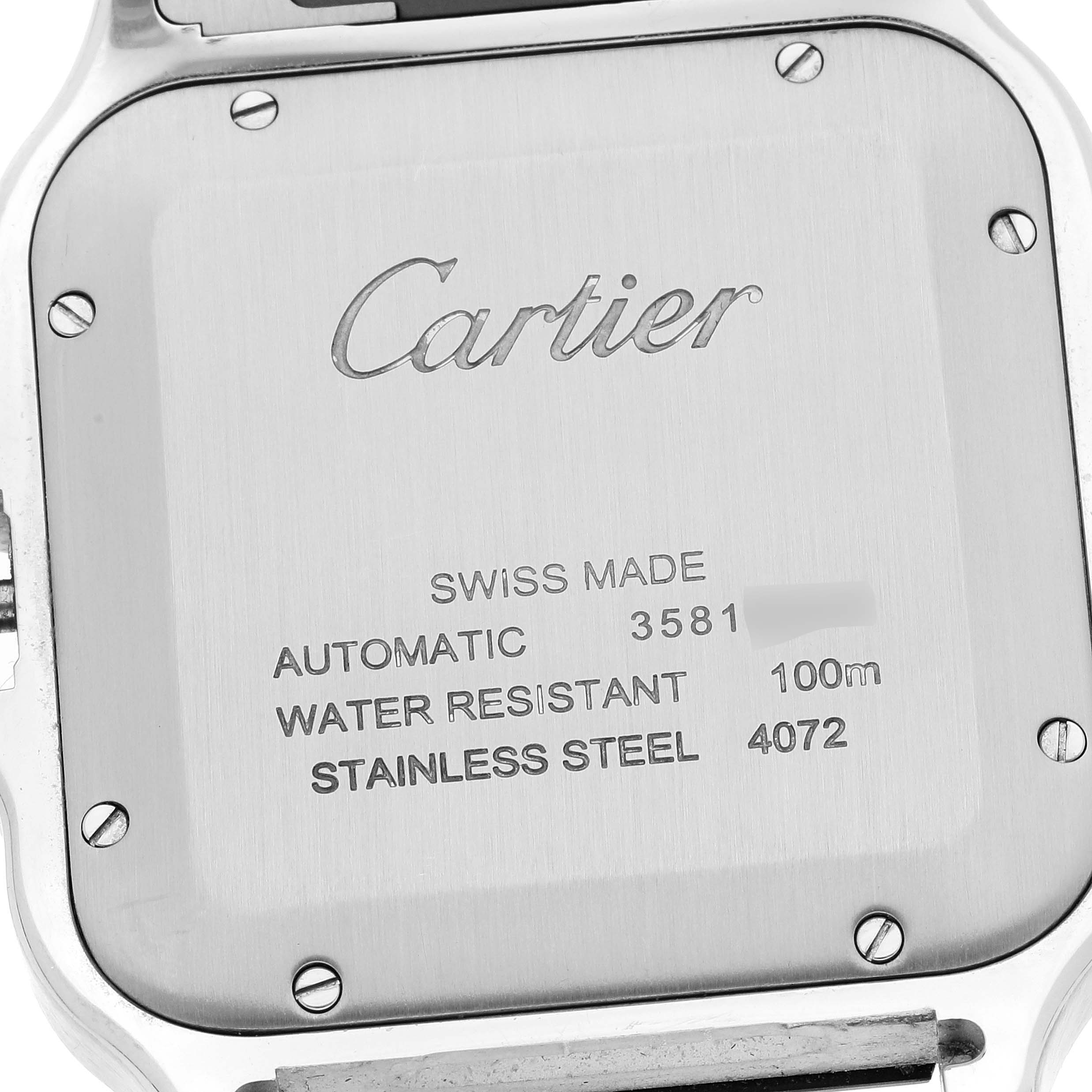 This image shows the case back of the Santos model by Cartier, displaying its specifications and brand engraving.
