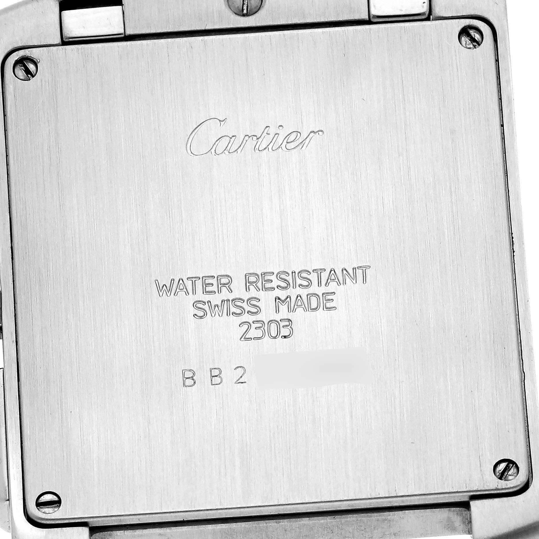 This image shows the back case of a Cartier Tank Francaise W51004Q4 Men's Steel and Gold (two tone) Silver Dial W51004Q4 Men's Steel and Gold (two tone) Silver Dial watch, highlighting its markings and screws.