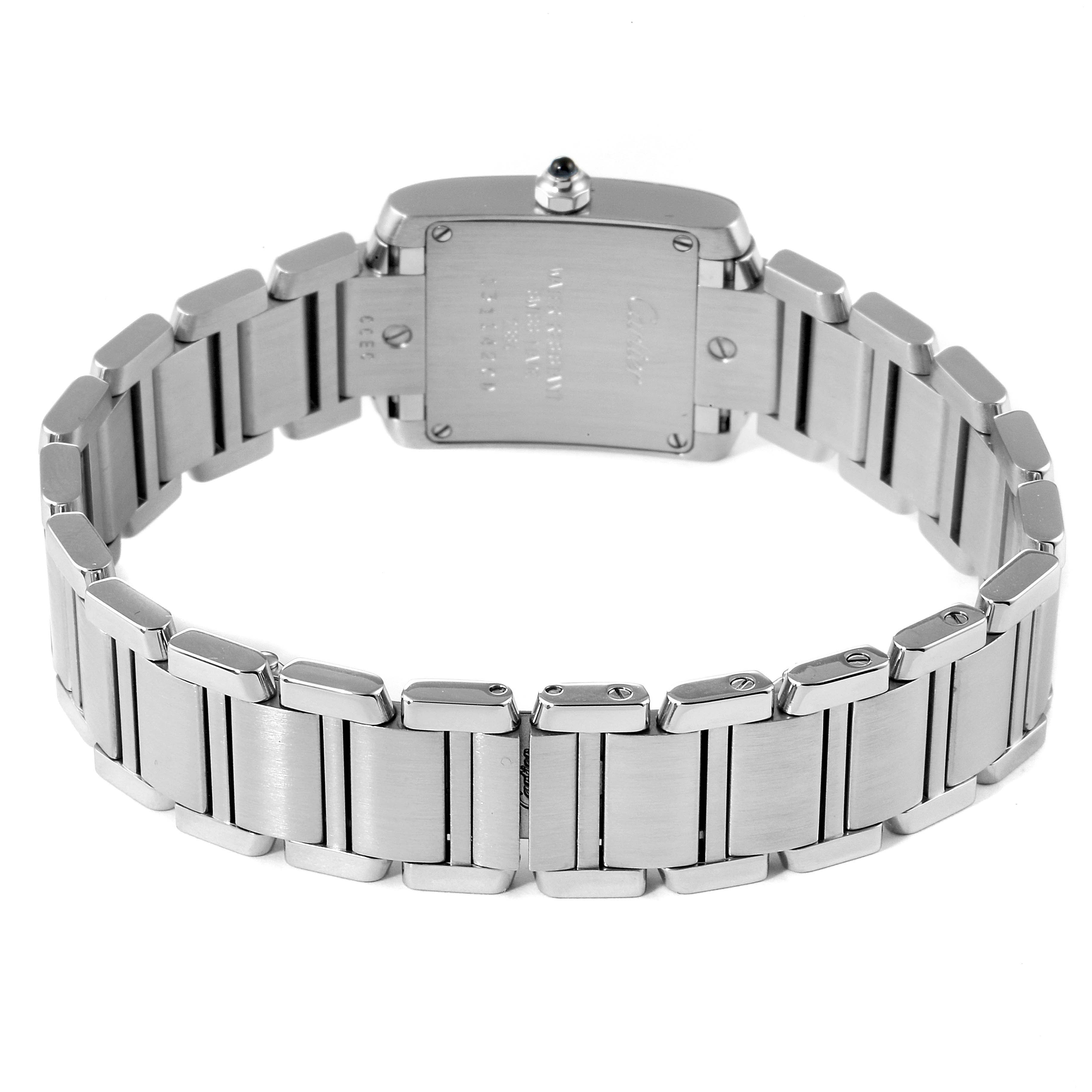 The image shows the back view of the Tank Francaise watch by Cartier, highlighting its metal bracelet and case back.