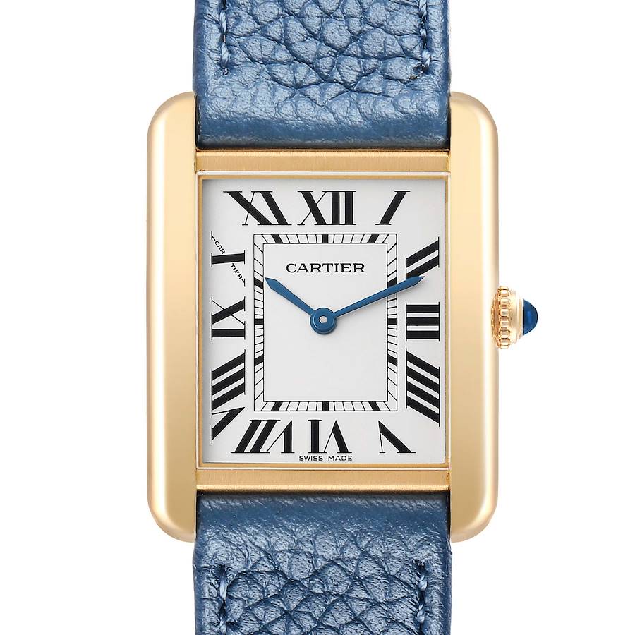 The Cartier Tank Solo W1018755 Women's Yellow Gold Silver Dial watch is shown from the front, displaying its rectangular face, Roman numerals, and a blue leather strap.