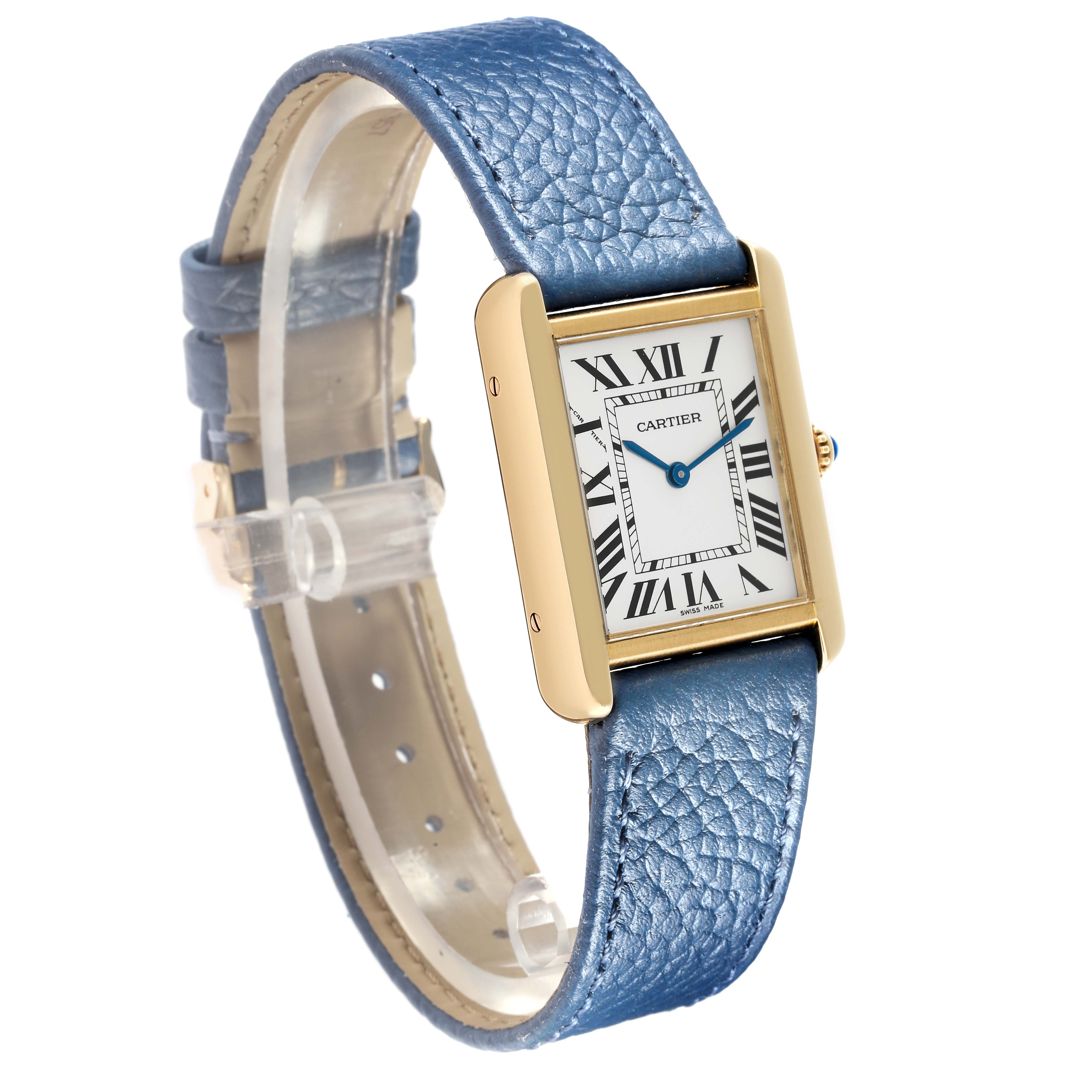 The image shows a Cartier Tank Solo W1018755 Women
s Yellow Gold Silver Dial watch angled to display its rectangular face and blue leather strap.