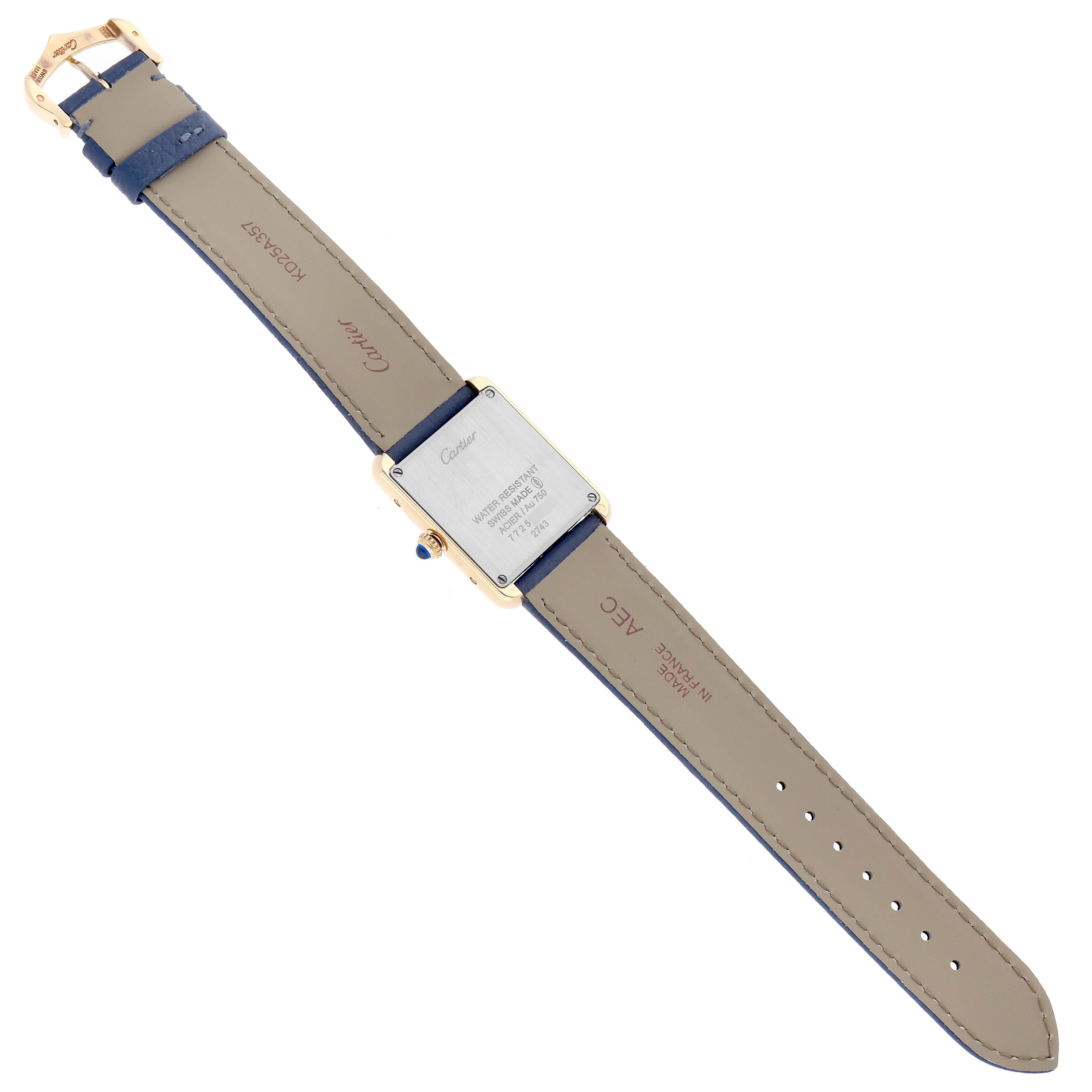 The Cartier Tank Solo W1018755 Women
s Yellow Gold Silver Dial watch is shown from the back, highlighting the case back, strap, and buckle.