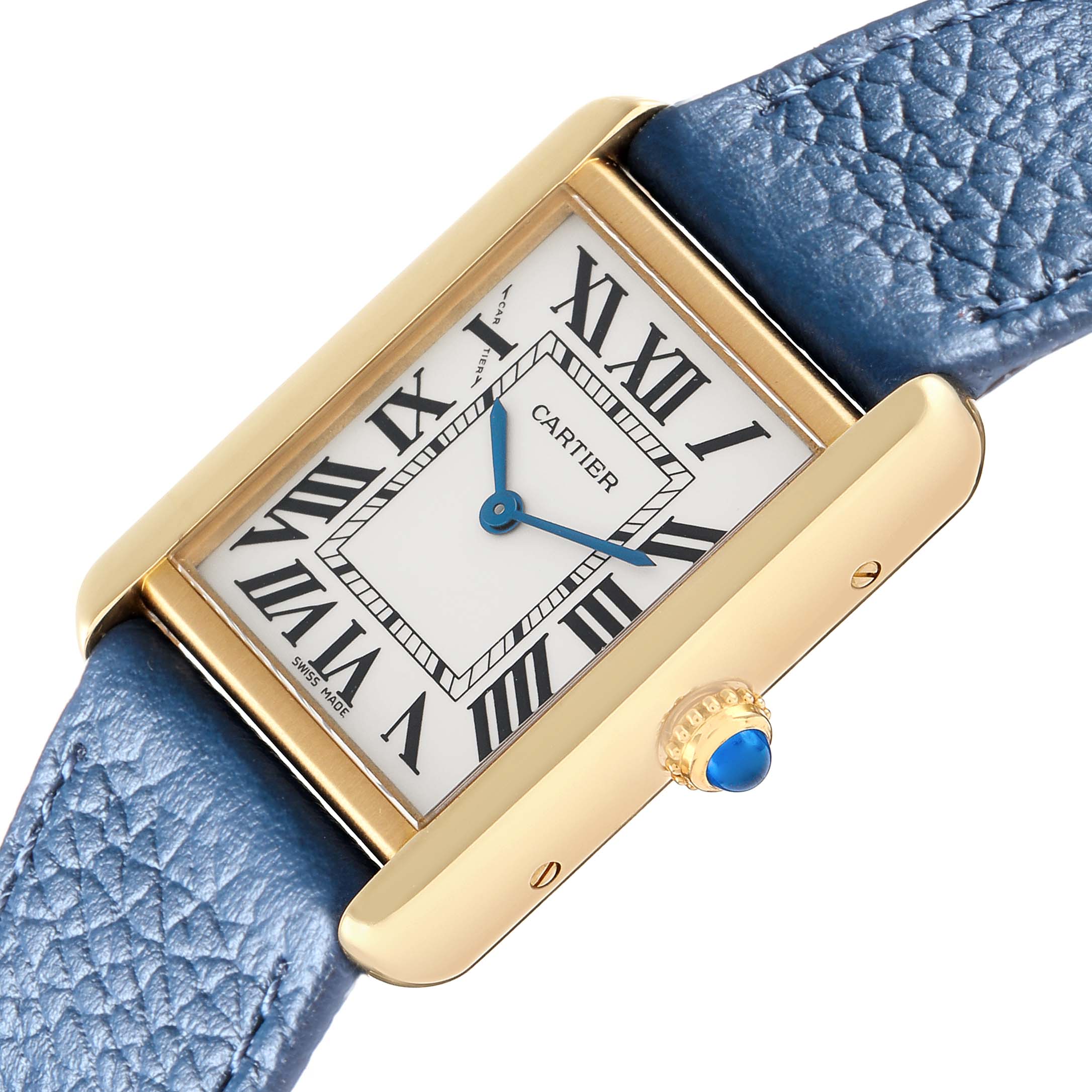 The Cartier Tank Solo W1018755 Women
s Yellow Gold Silver Dial watch is shown at an angled close-up, highlighting the dial, blue alligator strap, and blue cabochon crown.