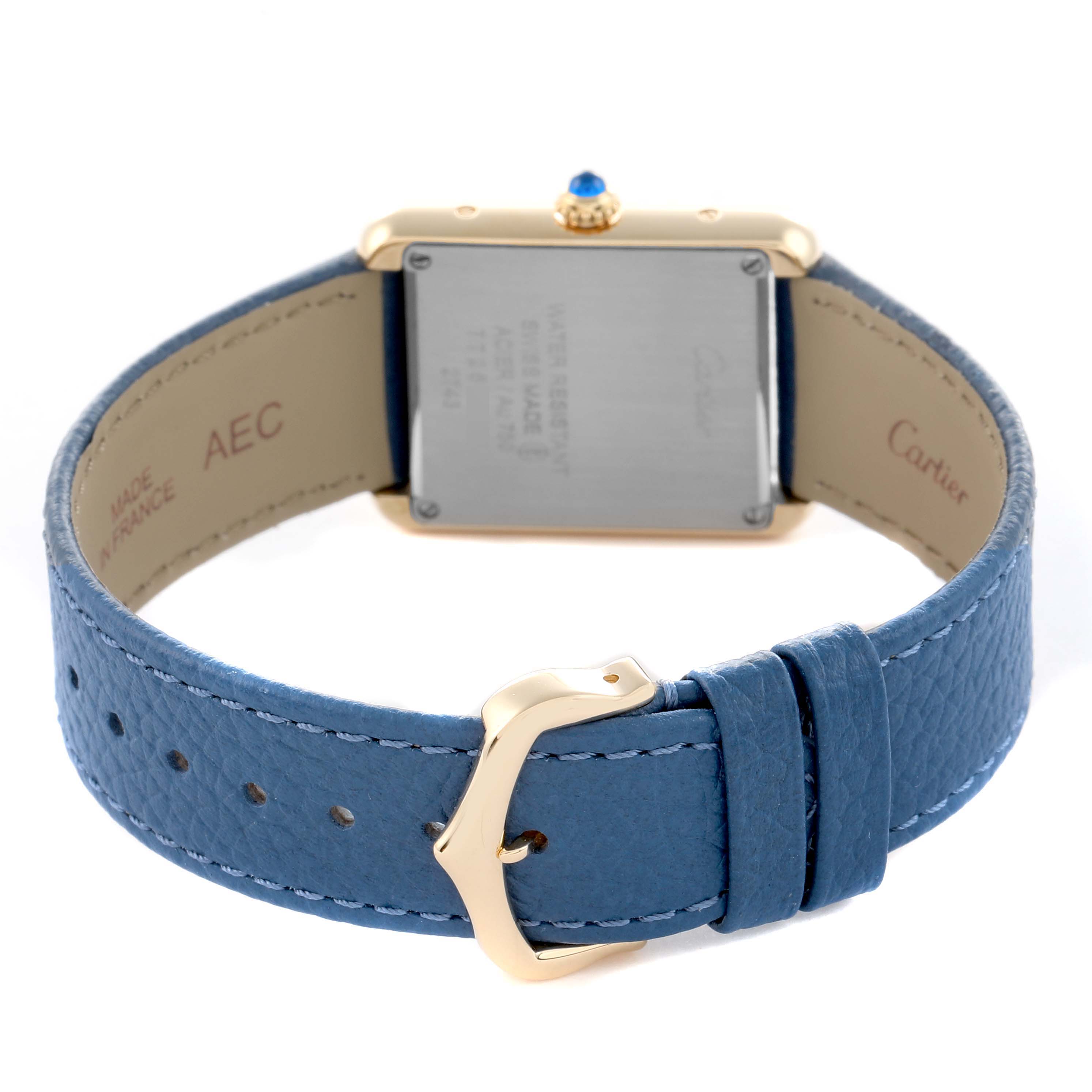 The image shows the back of a Cartier Tank Solo W1018755 Women
s Yellow Gold Silver Dial watch, highlighting the case back, strap, and buckle from a rear angle.