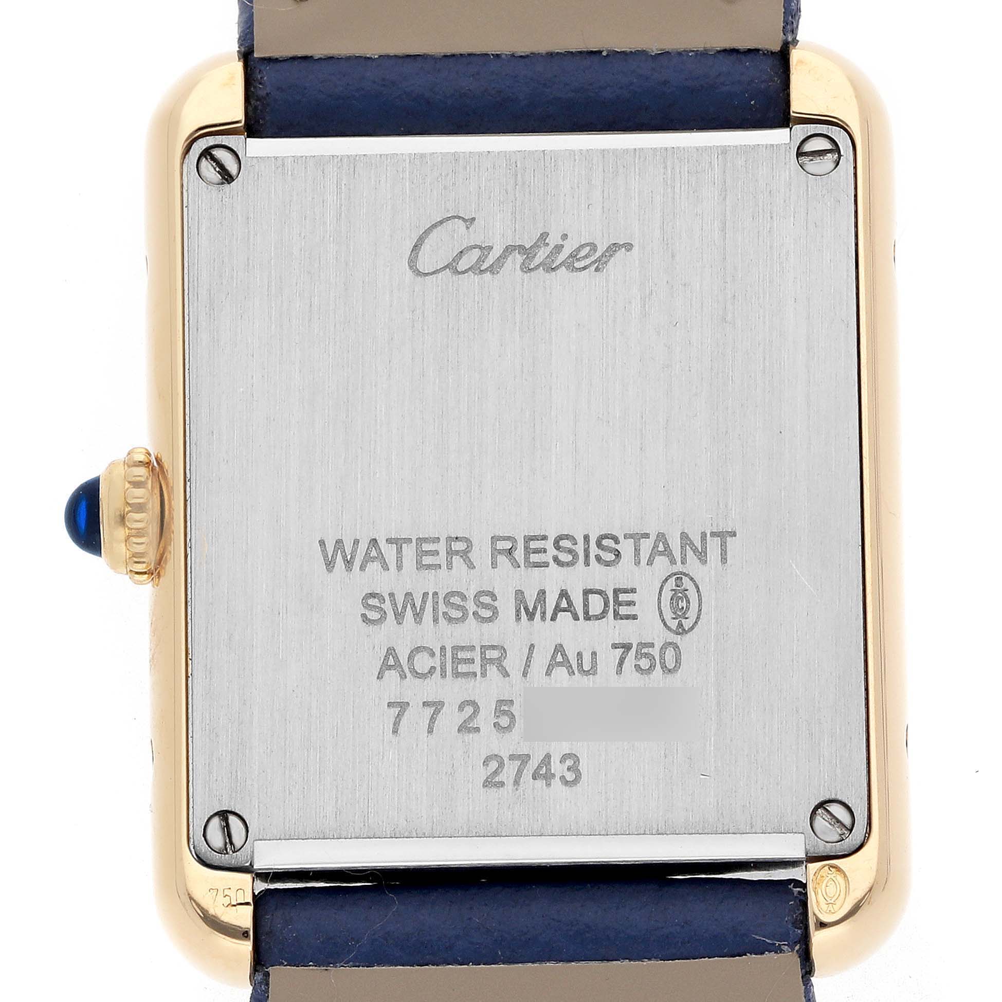 The image shows the back of the Cartier Tank Solo W1018755 Women
s Yellow Gold Silver Dial watch, highlighting the case back details and crown.