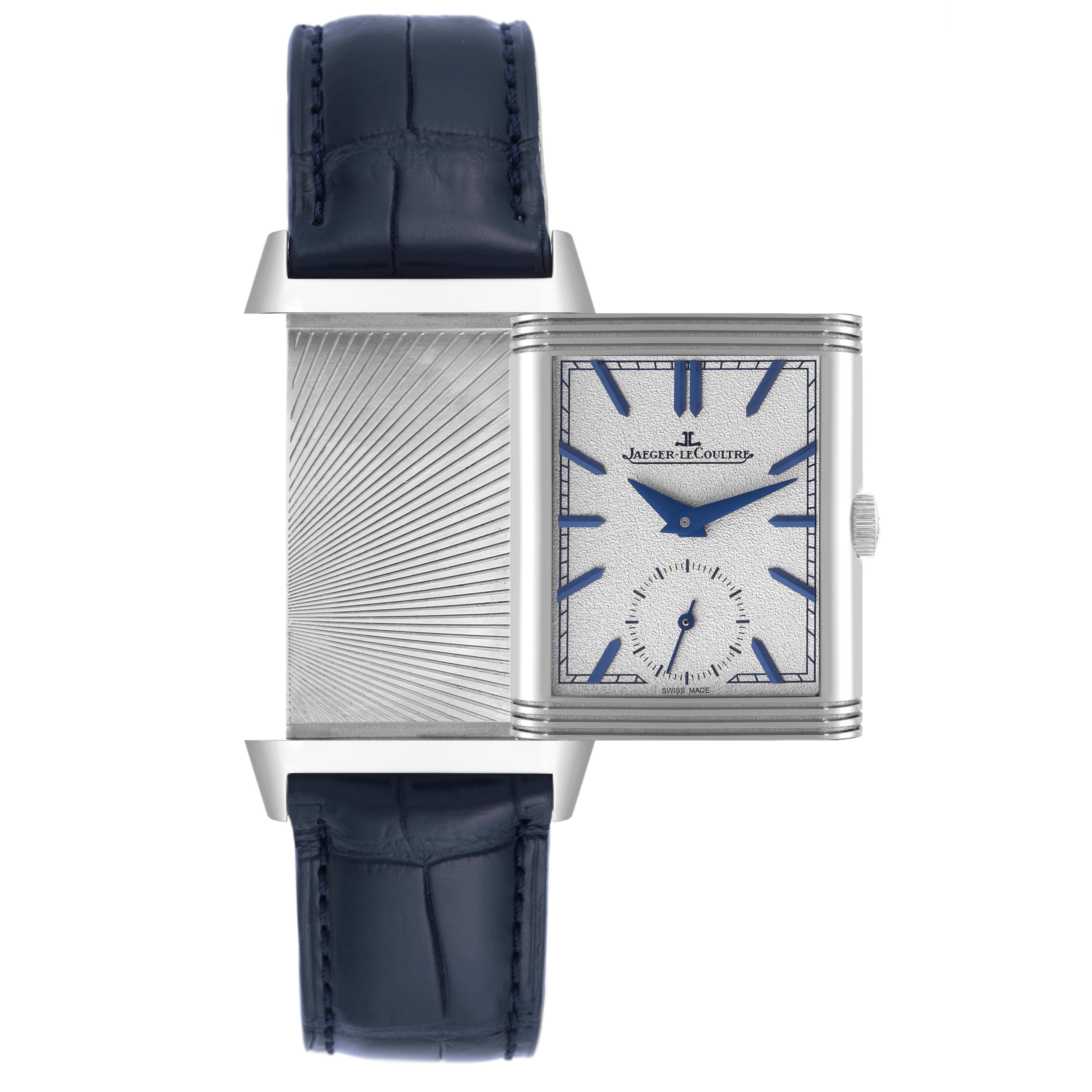 The Jaeger-LeCoultre Reverso watch is shown front-facing with its reversible case partially rotated, exposing the back.