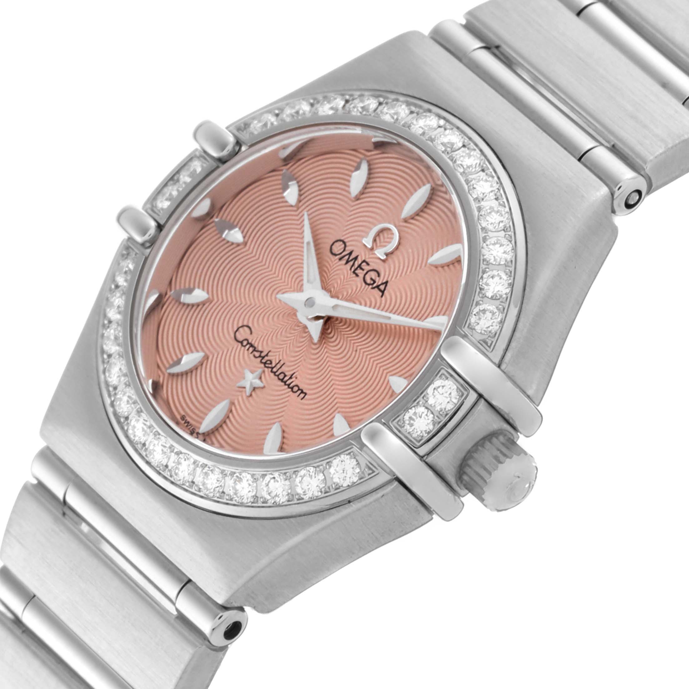 The image shows a close-up angle of the Omega 1466.62.00 Women's Stainless Steel Pink Dial 1466.62.00 Women's Stainless Steel Pink Dial Constellation Mini 22mm Salmon Dial Ladies Watch 1466.62.00, highlighting its dial and band.