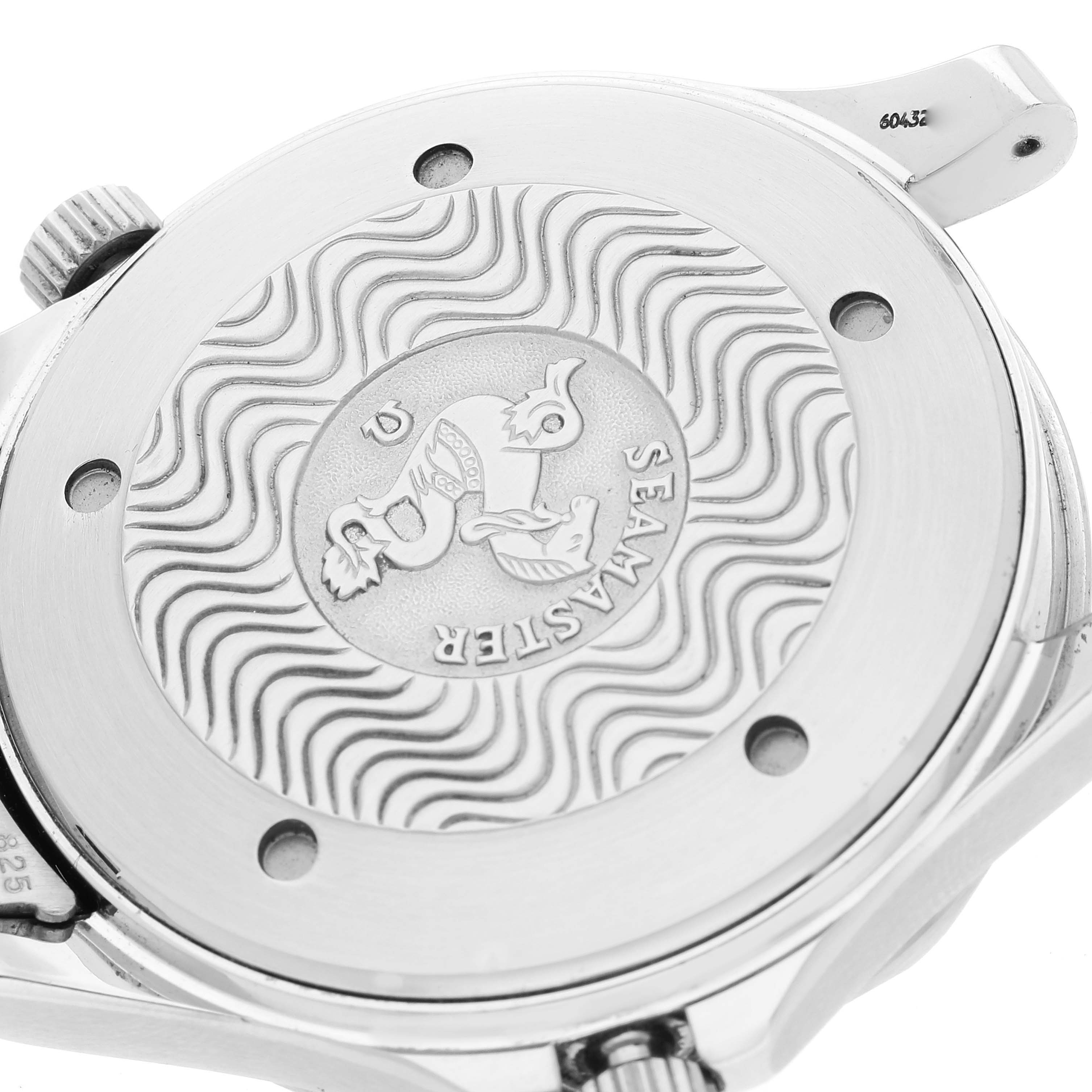 The image shows a close-up of the back case of an Omega Seamaster 2531.80.00 Men's Stainless Steel Blue Dial 2531.80.00 Men's Stainless Steel Blue Dial watch, highlighting its engravings and wave pattern design.