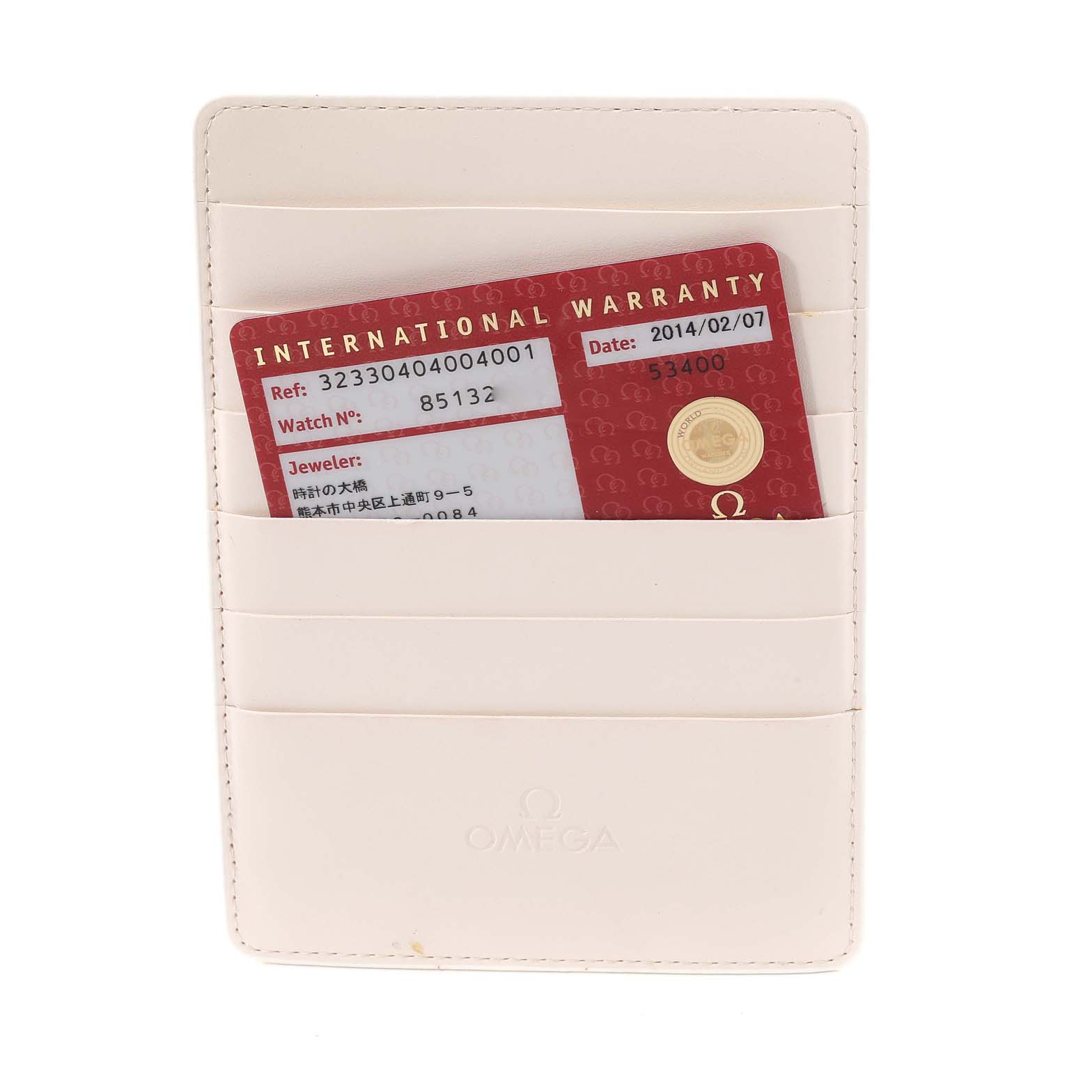 The image shows an Omega Speedmaster 323.30.40.40.04.001 Men
s Stainless Steel White Dial 323.30.40.40.04.001 Men
s Stainless Steel White Dial model
s international warranty card in a leather card holder.