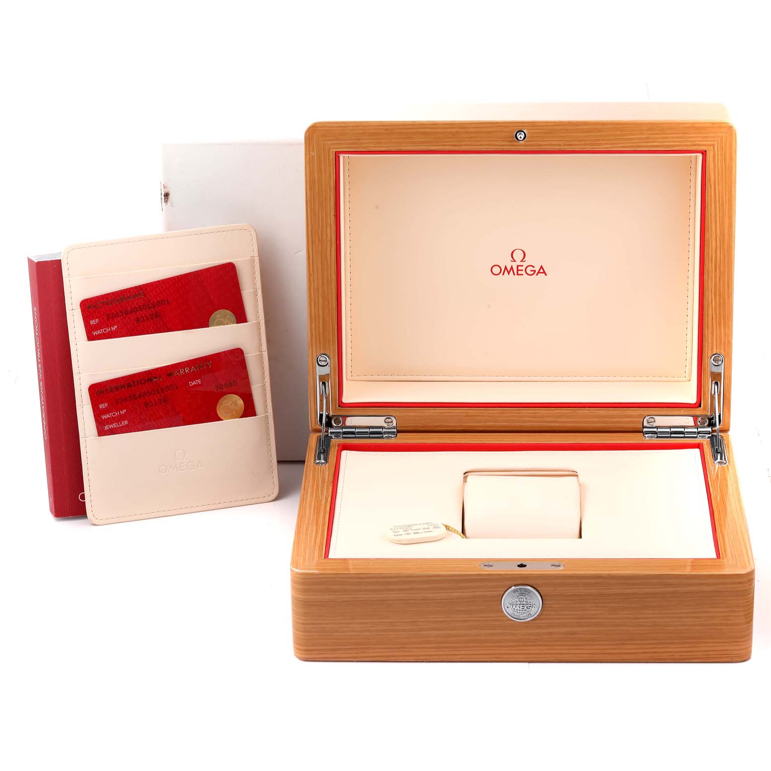 This image shows the open box and warranty cards for an Omega Speedmaster 326.30.40.50.11.001 Men's Stainless Steel Red Dial 326.30.40.50.11.001 Men's Stainless Steel Red Dial watch.