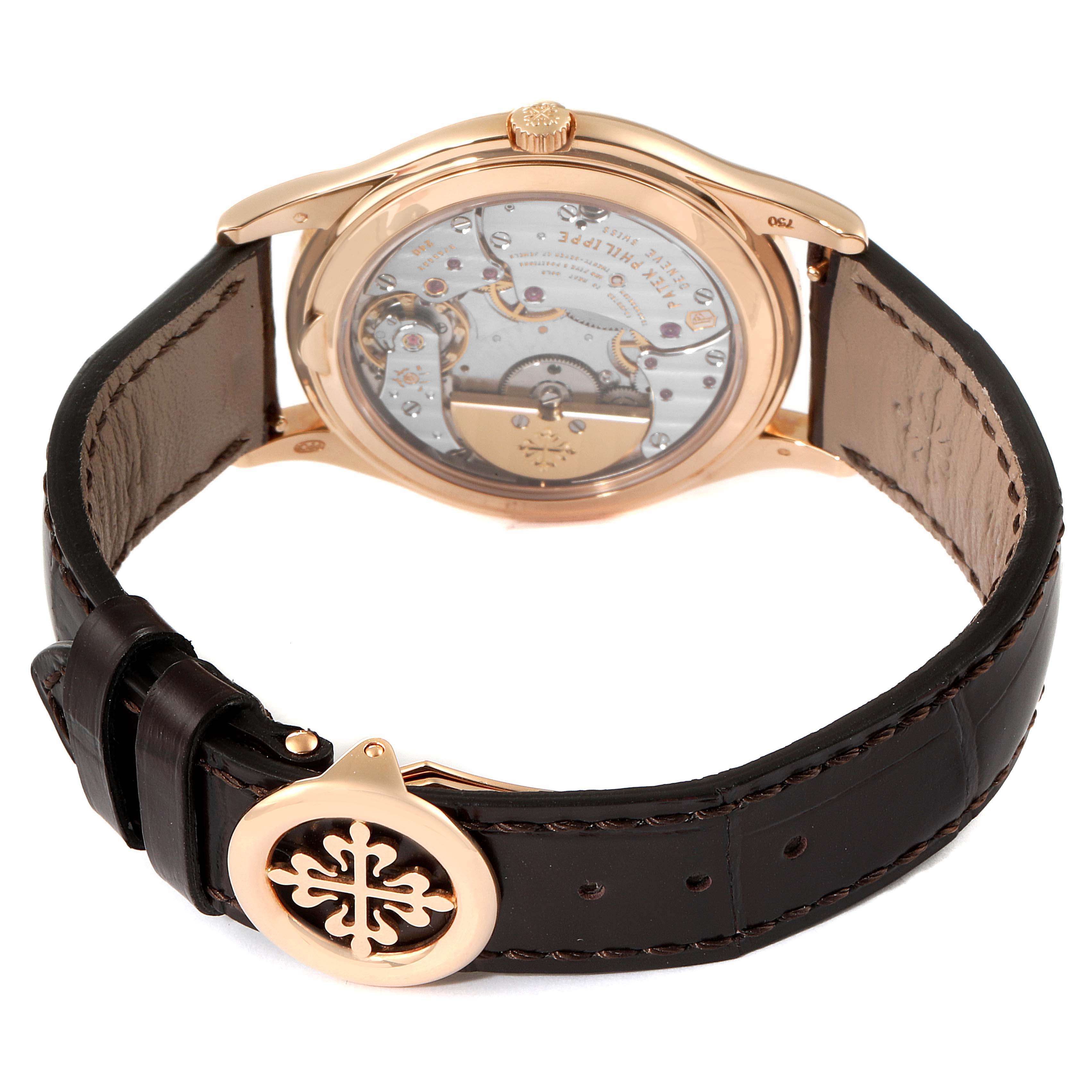 The image shows the back case and inner mechanism of the Patek Philippe 5140R-001 Men's Rose Gold Brown Dial 5140R-001 Men's Rose Gold Brown Dial Complicated Perpetual Calendar Rose Gold Mens Watch 5140.