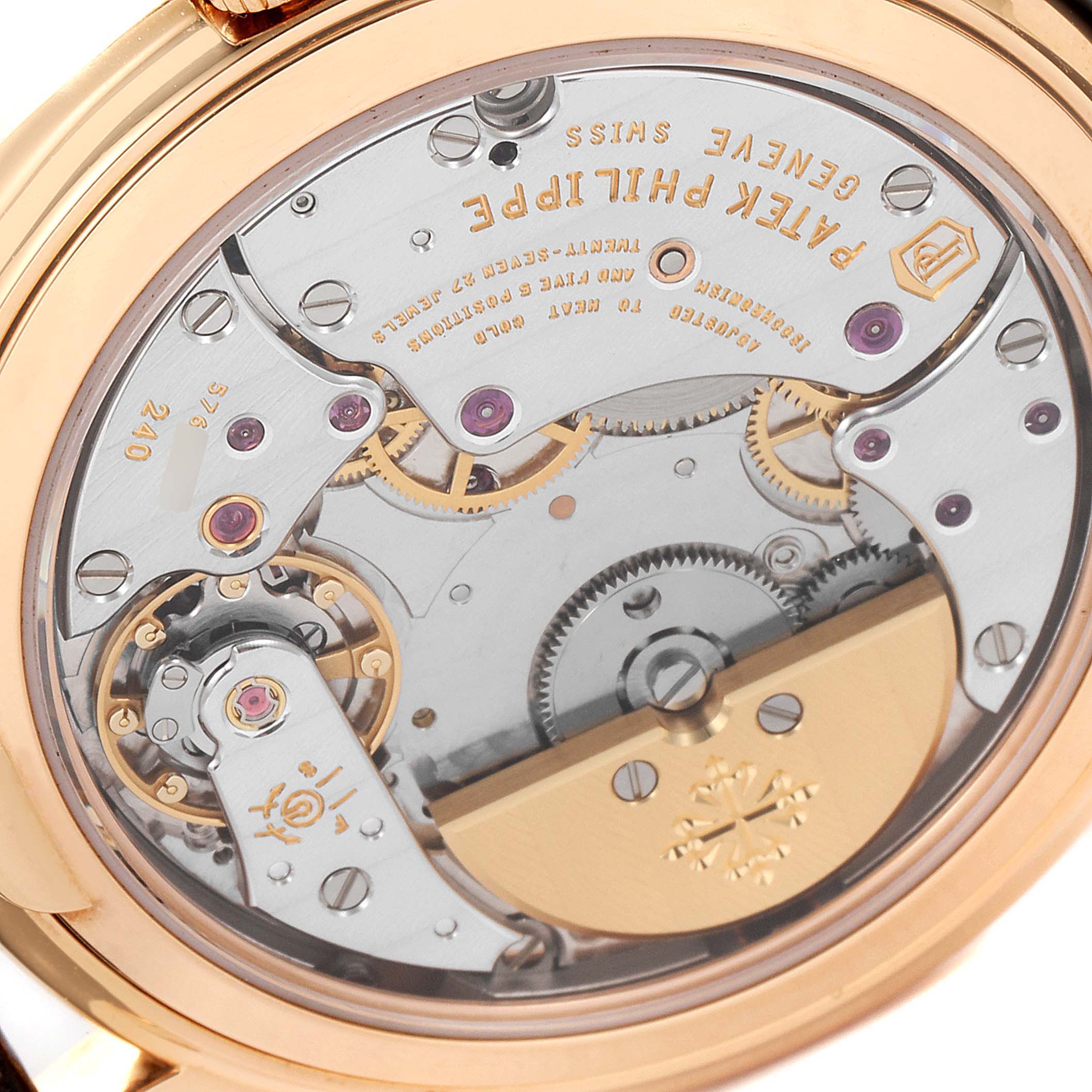 The image shows the back view of the Patek Philippe 5140R-001 Men's Rose Gold Brown Dial 5140R-001 Men's Rose Gold Brown Dial Complicated Perpetual Calendar Rose Gold Mens Watch 5140 model, revealing its inner mechanics.