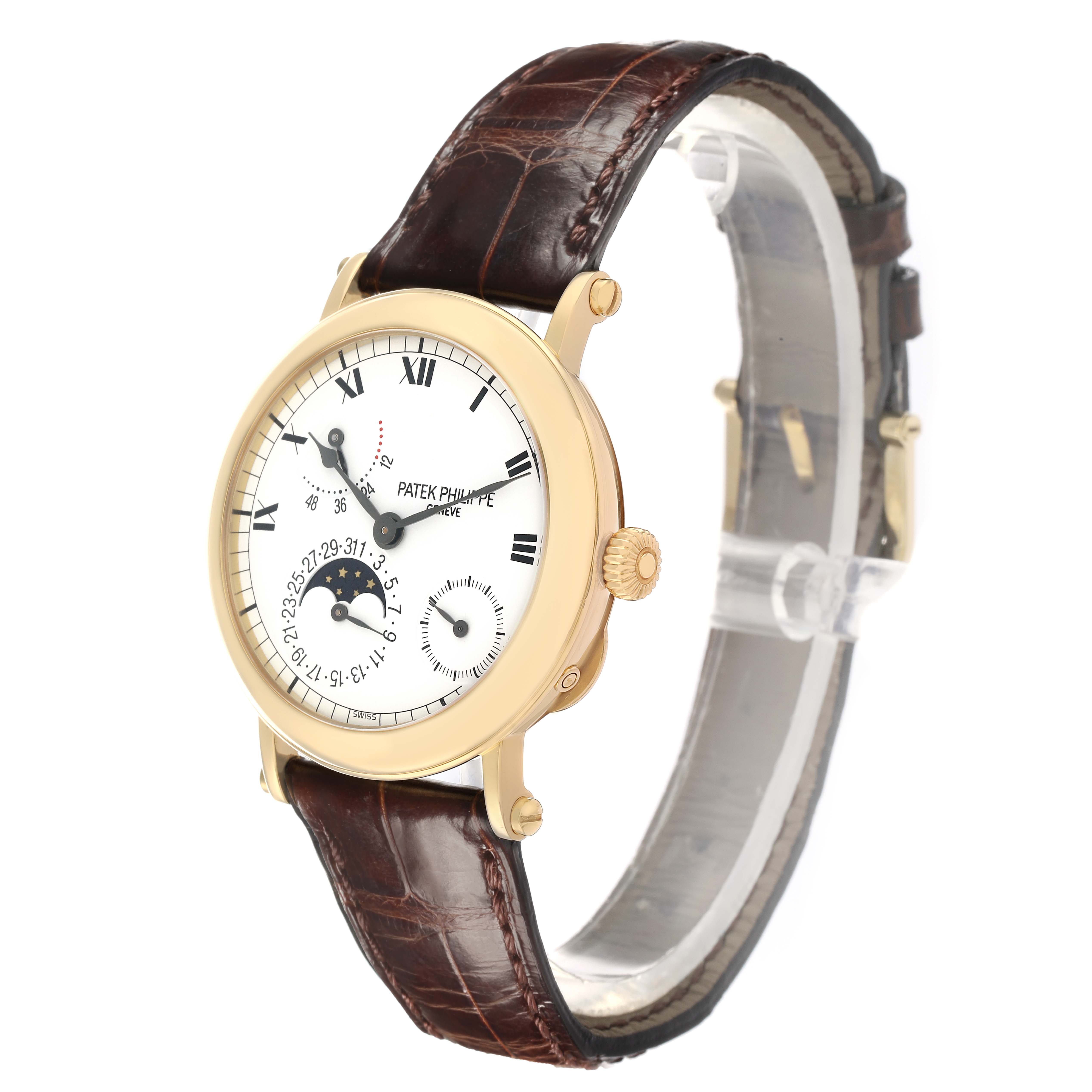 The Patek Philippe Complications 5054 Men
s Yellow Gold White Dial watch is shown at a slight angle, highlighting the dial, hands, and brown leather strap.