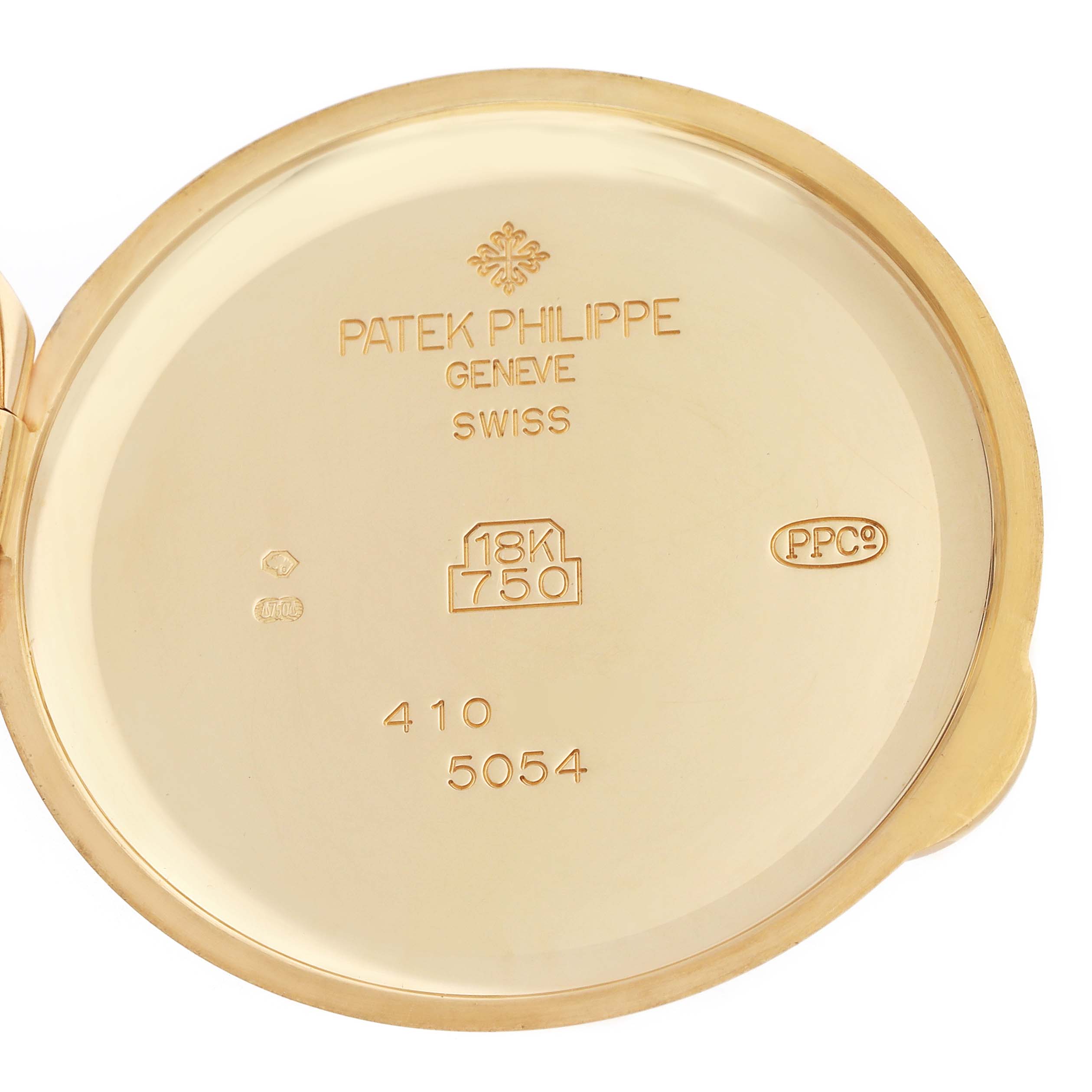 The image shows the inner case back of a Patek Philippe Complications 5054 Men
s Yellow Gold White Dial watch, highlighting engravings and hallmarks.