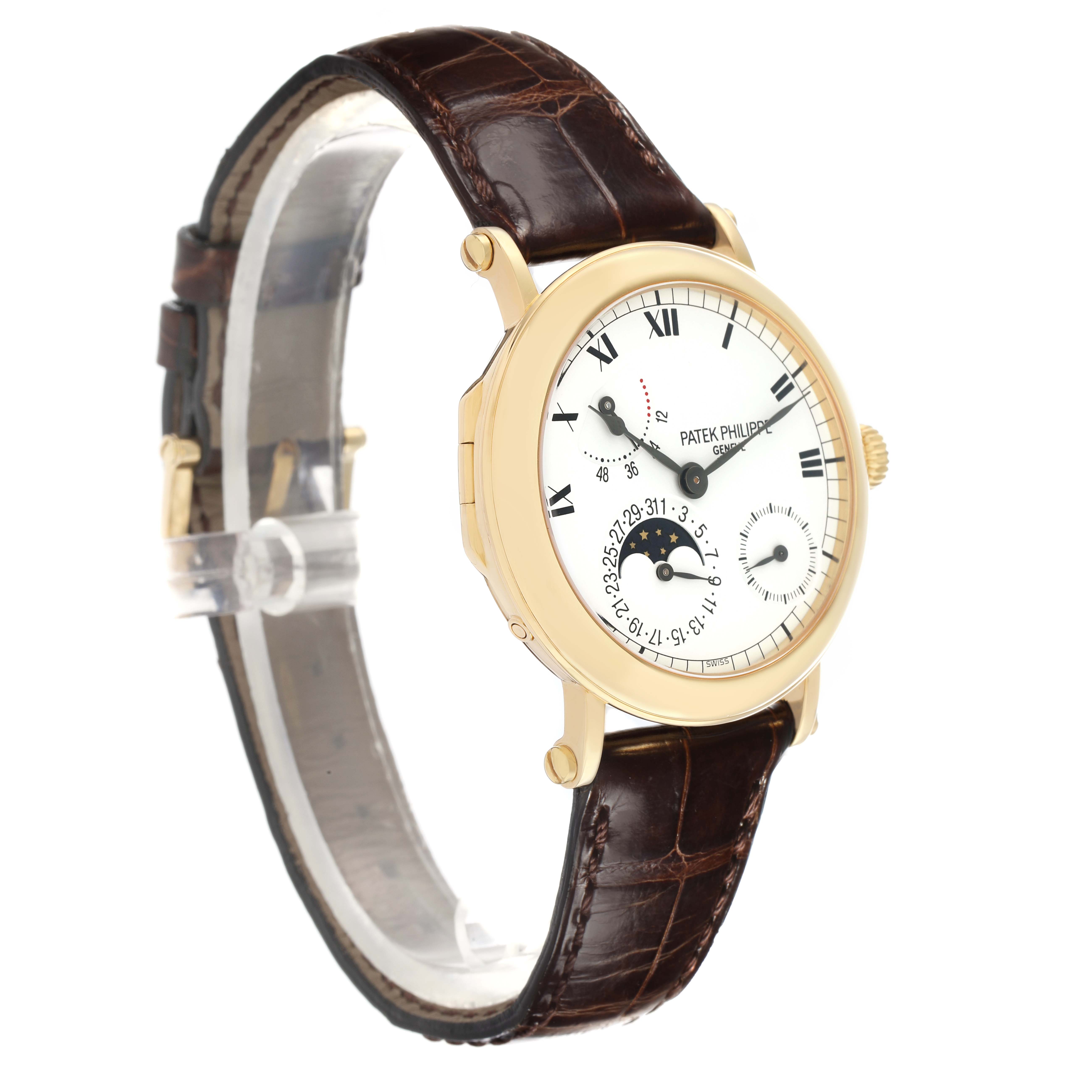 The Patek Philippe Complications 5054 Men
s Yellow Gold White Dial watch is shown from a front-side angle, displaying the face, case, and leather strap.