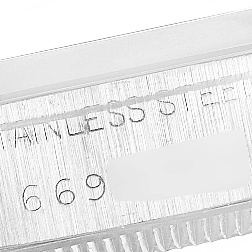 The image shows a close-up of the case side of a Rolex Vintage Collection 5500 Men's Stainless Steel Silver Dial 5500 Men's Stainless Steel Silver Dial watch, highlighting the serial number and stainless steel engraving.