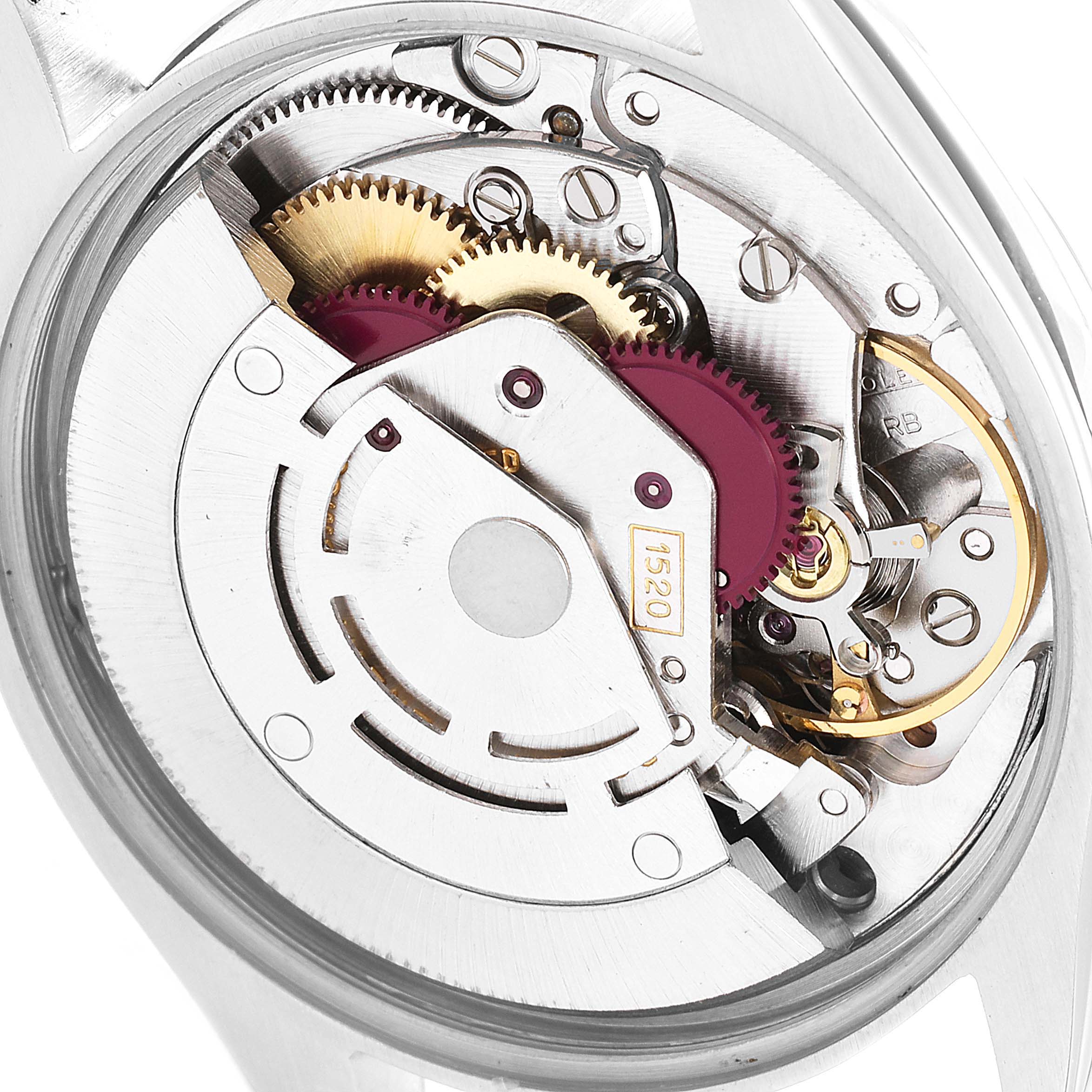 This is a close-up image of the internal movement mechanism of the Vintage Collection Rolex watch, showing gears and components.