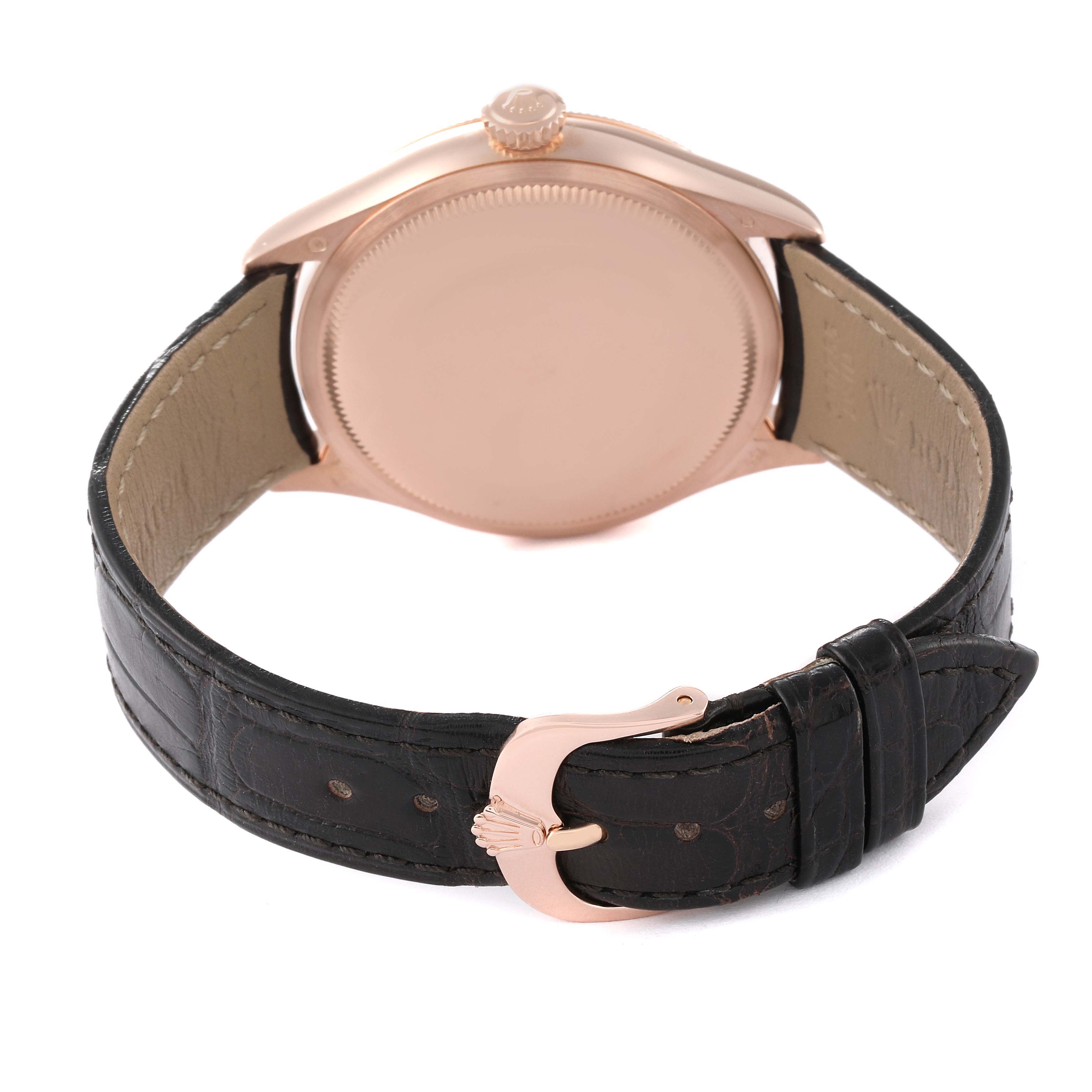 The image shows the back case and leather strap of a Rolex Cellini 50505 Men's Rose Gold White Dial 50505 Men's Rose Gold White Dial watch at an angle.