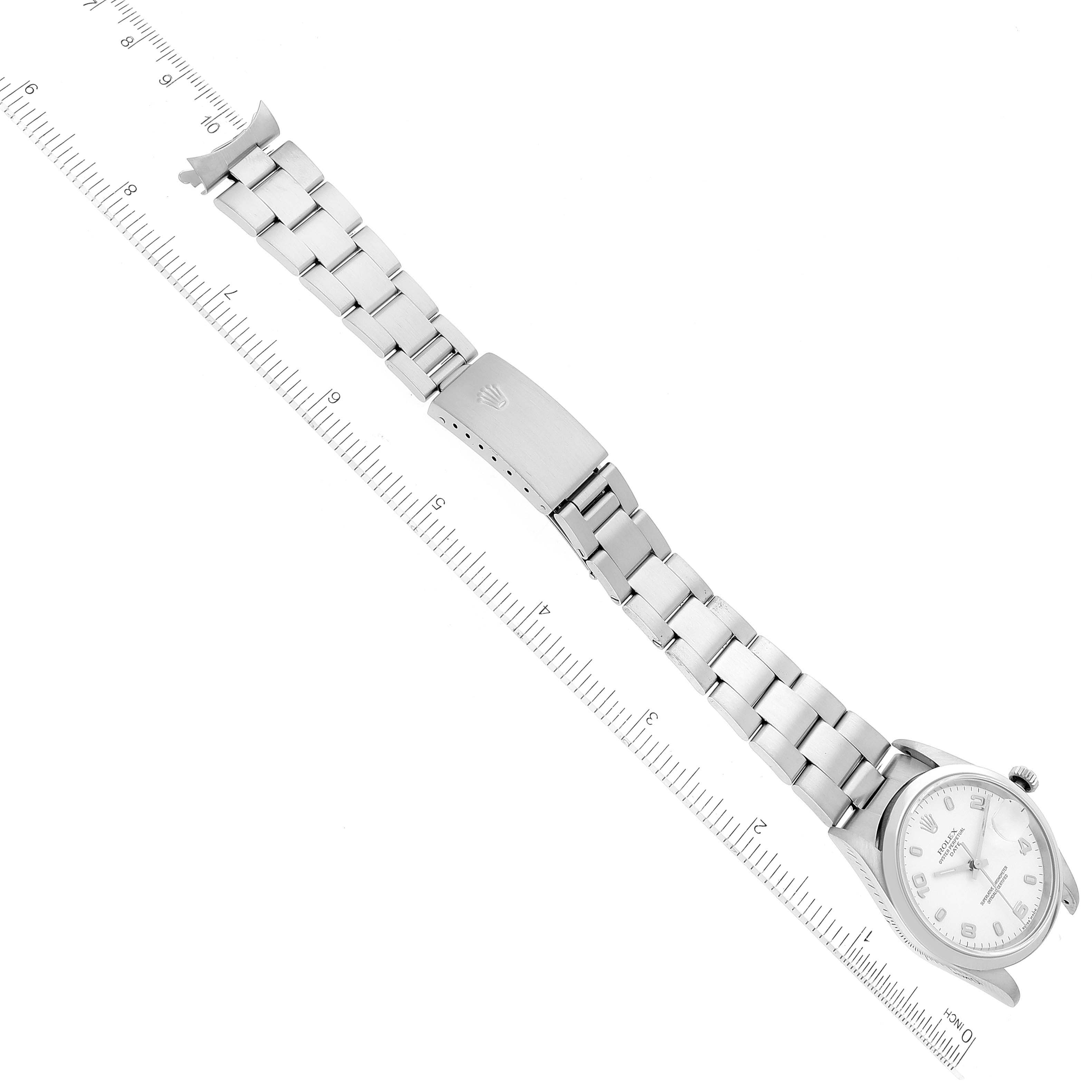 The image shows a Rolex Date 15200 Men's Stainless Steel White Dial 15200 Men's Stainless Steel White Dial model watch laid flat with a ruler, displaying the bracelet and clasp.