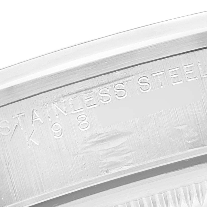 The image shows a close-up of the case back and engravings of a Rolex Date 15200 Men's Stainless Steel White Dial 15200 Men's Stainless Steel White Dial model watch, indicating "STAINLESS STEEL."