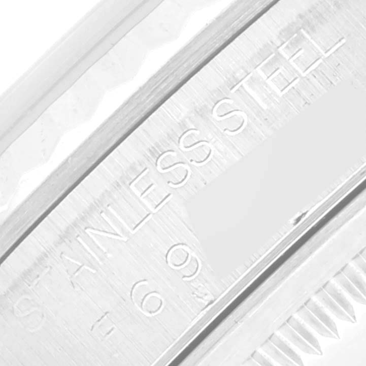 This image shows a close-up of the side of a Rolex Datejust 16234 Men's Stainless Steel White Dial 16234 Men's Stainless Steel White Dial watch with a focus on the stainless steel marking.