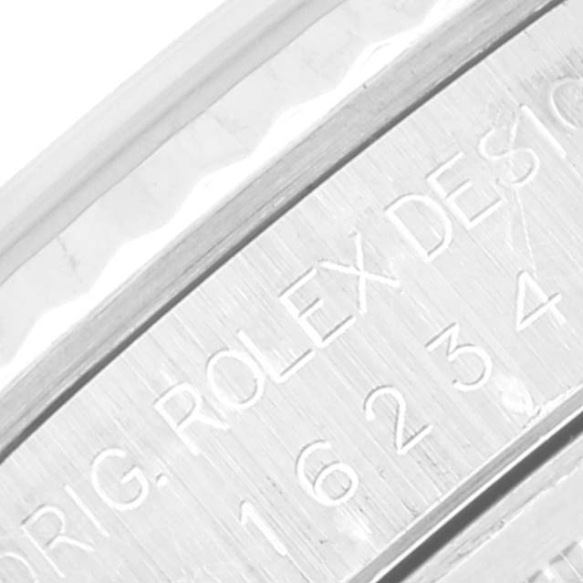 This image shows a close-up angle of the engraved side of the bezel on a Rolex Datejust 16234 Men's Stainless Steel White Dial 16234 Men's Stainless Steel White Dial model.
