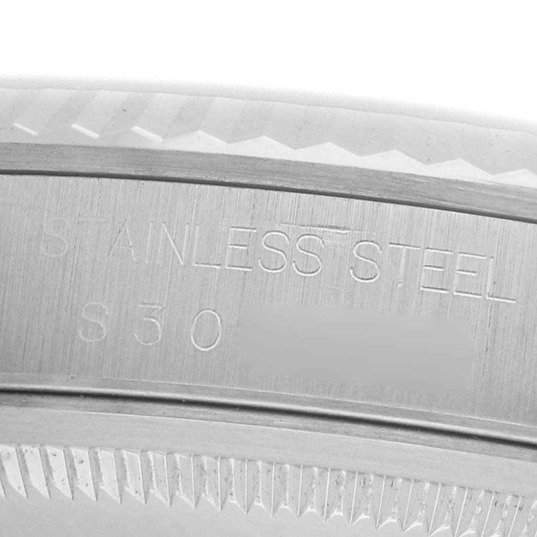The image shows a close-up of the stainless steel case edge and bezel of a Rolex Datejust 16234 Men
s Stainless Steel Silver Dial watch.