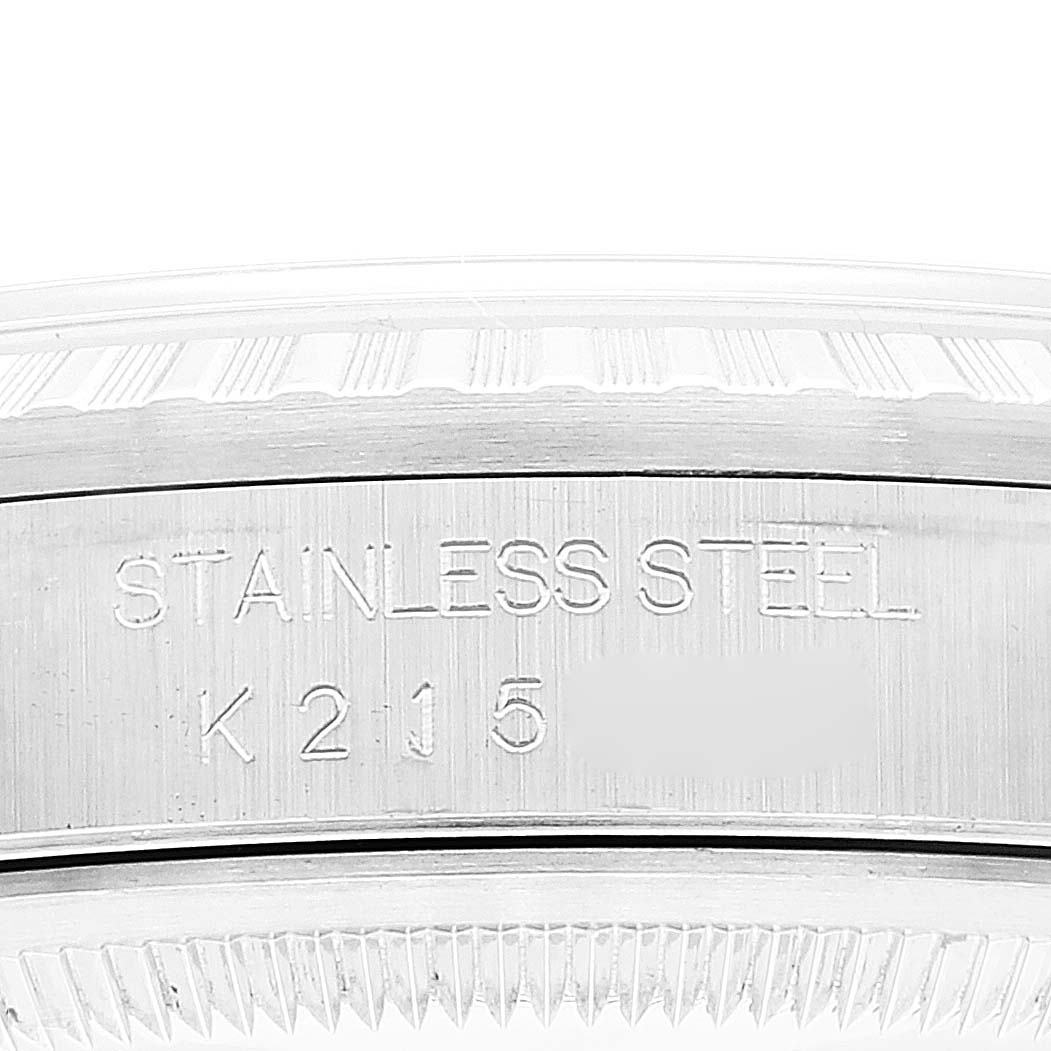 The image shows a close-up of the side of the bezel and caseback of a Rolex Datejust 16220 Men's Stainless Steel White Dial 16220 Men's Stainless Steel White Dial watch, displaying "STAINLESS STEEL" engraving.