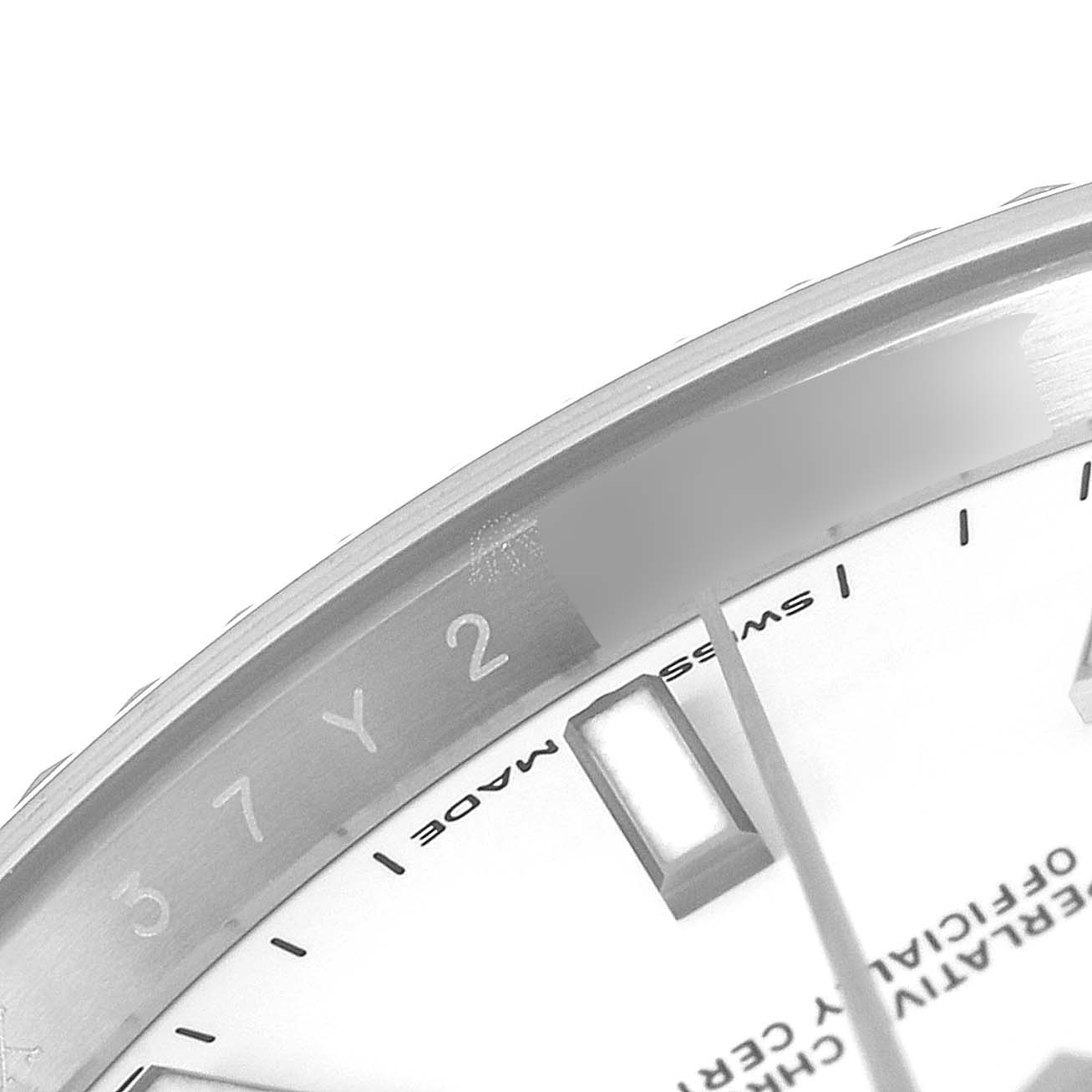 This image shows a close-up of the bezel, part of the dial, and markers of a Rolex Datejust 41 126334 Men
s Stainless Steel White Dial 126334 Men
s Stainless Steel White Dial watch.