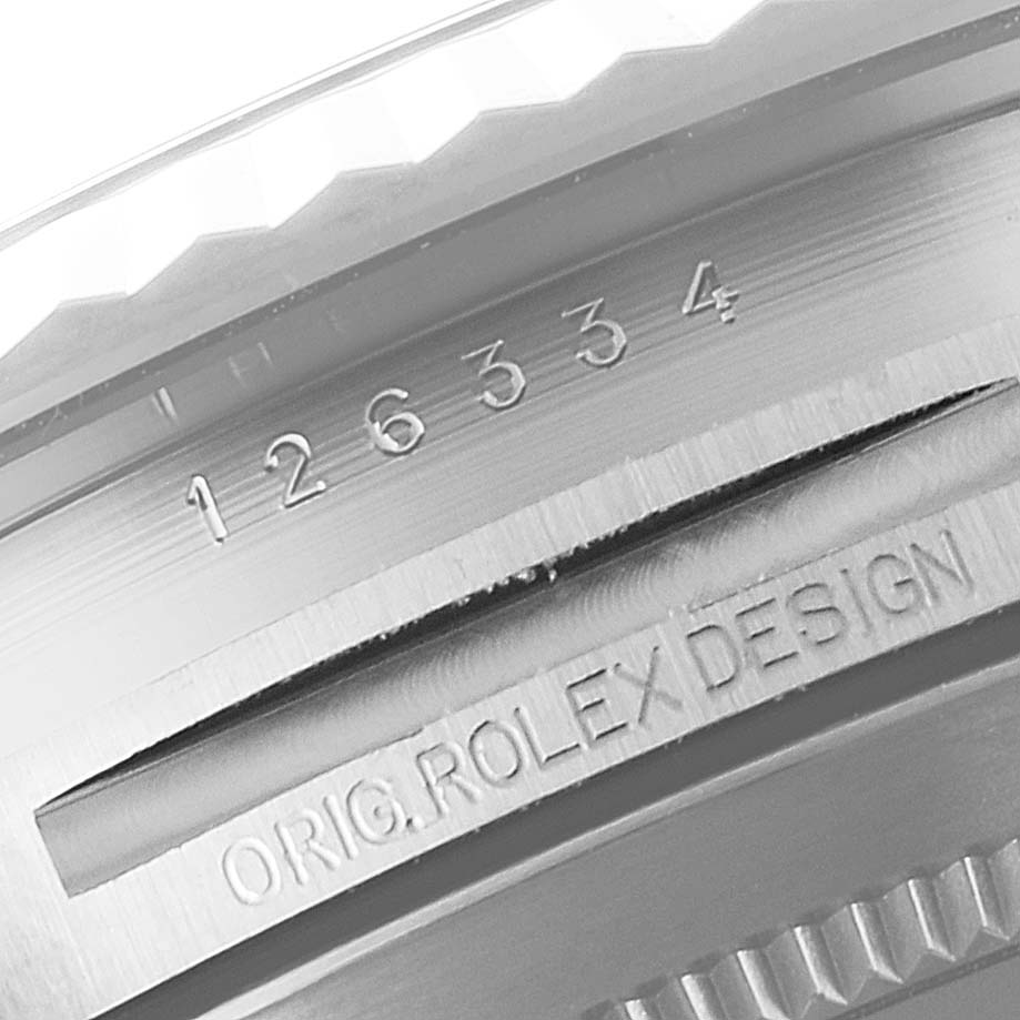 This image shows a close-up of the case side of a Rolex Datejust 41 126334 Men
s Stainless Steel White Dial 126334 Men
s Stainless Steel White Dial, highlighting the serial number and "ORIG. ROLEX DESIGN" engraving.