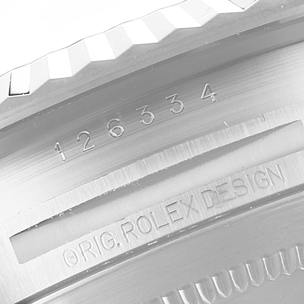 This close-up image shows the serial number and "ORIG. ROLEX DESIGN" engraving on the Rolex Datejust 41 126334 Men
s Stainless Steel Silver Dial 126334 Men
s Stainless Steel Silver Dial model bezel.