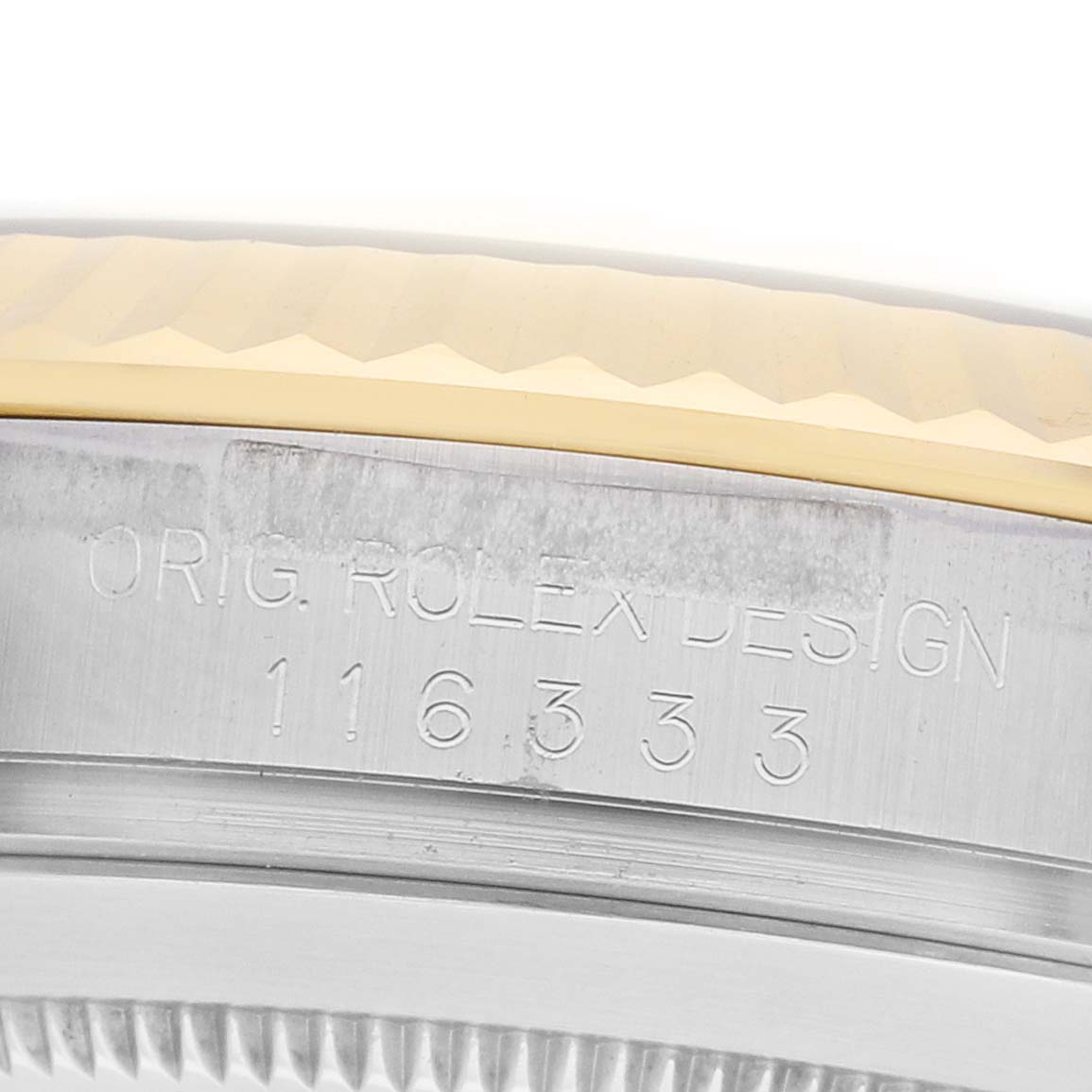 The image shows a close-up of the Rolex Datejust 116333 Men
s Steel and Gold (two tone) Grey Dial
s engraved case side with the model number 116333.